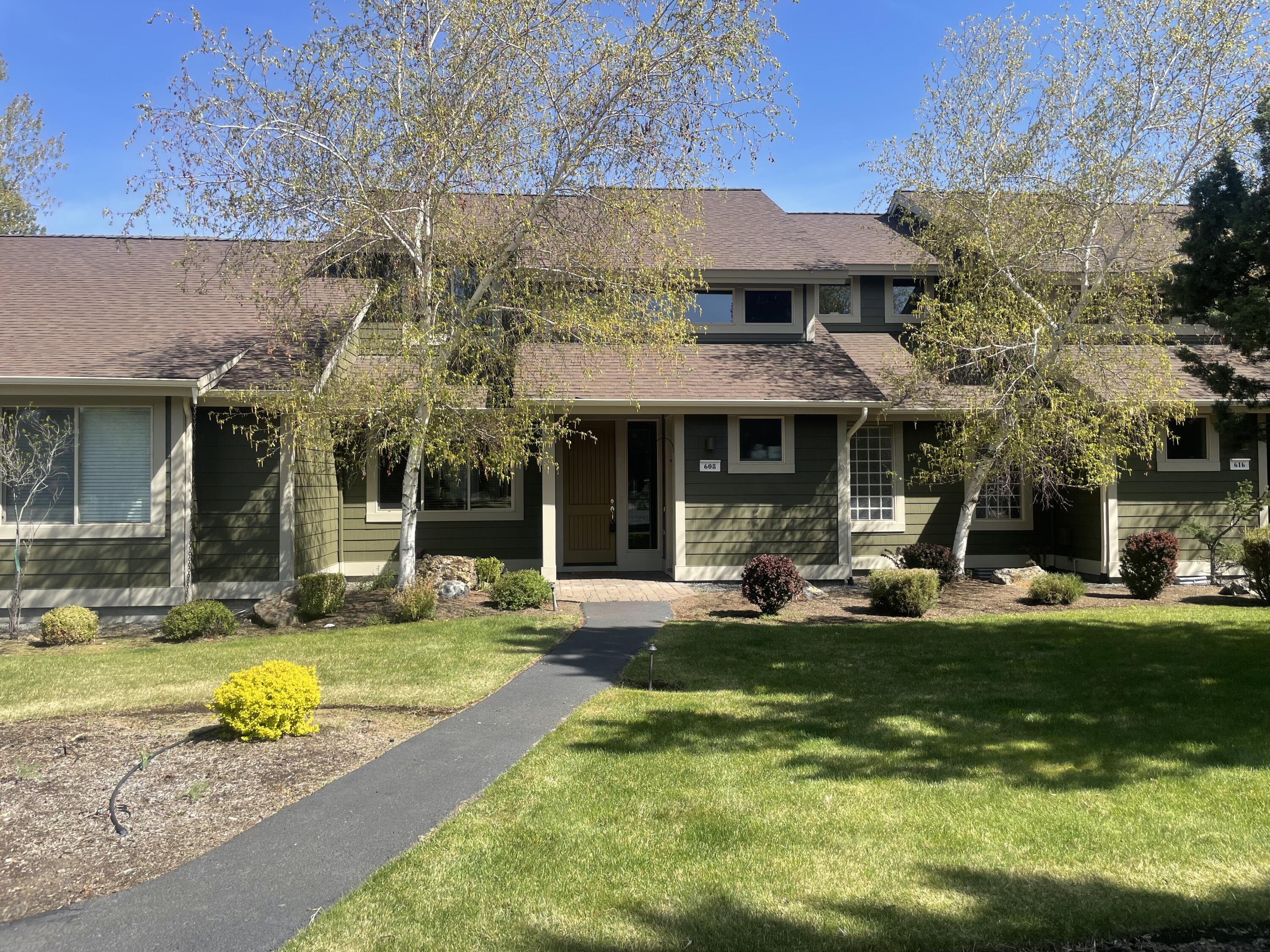 Highly sought-after Eagle Crest townhome located on the creek and directly across from BLM land with private trail access. Just steps from the Lakeside Sports Center, pool, and pickleball courts, this fully furnished 3-bedroom, 2.5-bath unit includes a hot tub, dog door in the sliding glass door, and a back patio with gated access. Inside, a slate tile entry opens to soaring vaulted ceilings and floor-to-ceiling windows framing stunning creek views. The gourmet kitchen features granite countertops, stainless steel appliances, a large picture window, under-cabinet lighting, and flows seamlessly into the spacious living area—perfect for entertaining. The main-floor primary suite offers patio access and a luxurious ensuite with soaking tub, shower, double vanity, enclosed toilet, and laundry closet. Upstairs, a loft with a pullout sofa complements two additional bedrooms—one with a queen bed, the other with a queen/twin bunk—plus a full bath. Call your agent today!