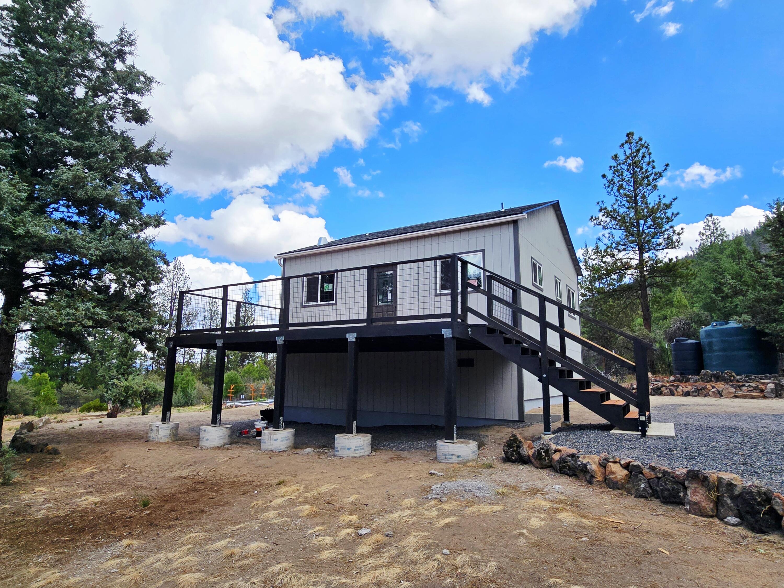 *Permitted New Construction* Nestled in the serene rural community of Beatty, Oregon, this 1.98-acre fully fenced property offers endless potential. Construction has already begun with permits & inspections, leaving the opportunity for someone to step in and complete the process. Many things the seller has already done! 3/4 minus driveway. Clearing has been done with views of the mountains and canyon. There are 2 holding tanks 3,000 gallons and 500 gallons, to the right of these is a small potato patch. This property has a woodshed and green house with garden boxes. The house has a stem wall, trusses, windows & doors, the house has been wrapped with vaporlock and there is a moisture barrier under the home. There is a 1,000 gal. septic tank and plumbing from tank to the house has been laid. Deck and railings are installed, siding and roofing is completed... Now its time for the inside!!