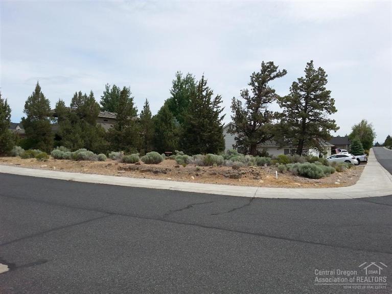 Ready for that great home to be built in the desirable golf community of the Greens at Redmond? This corner lot is ready for you! Natural gas, power, water, sewer and cable TV connection in place at lot line. Drive your golf cart down to the pro shop. One of the few lots remaining in this wonderful neighborhood!