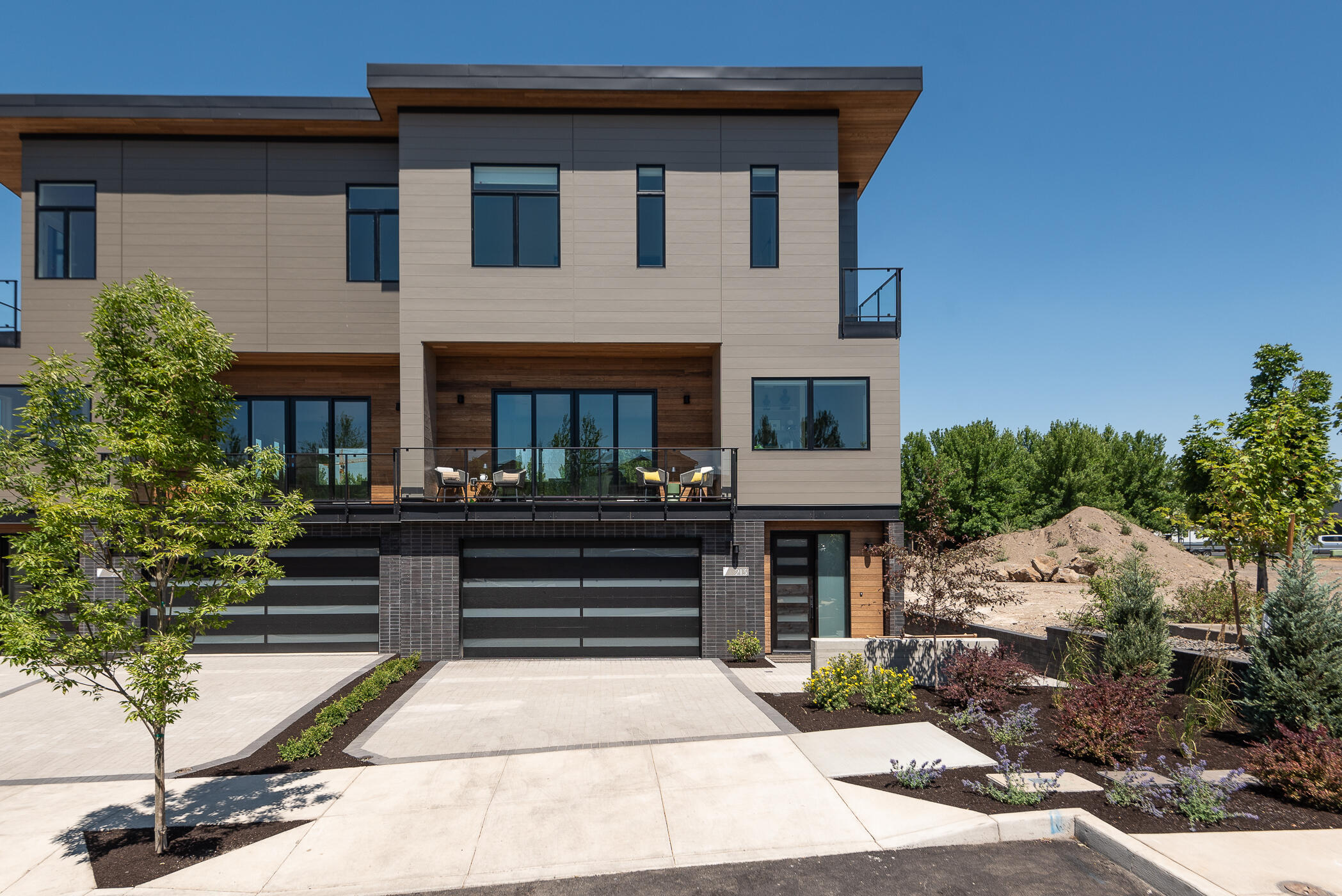 Introducing Arrowood's Eight in the heart of the Old Mill District. Located just a stone's throw from The Box Factory, Crosscut, Crux, The Shops at the Old Mill and a few blocks to Downtown Bend. Prime location with easy access to everything including shopping, dining, fitness, Deschutes River, trails, concerts, nightlife, and Hwy 97. Features include 3 bedrooms, an open great room concept, ample outdoor deck space, a lock-off flex space downstairs with a private entrance, bath and all appliances. These stunning contemporary townhomes, decked out in designer finishes have no overnight rental restrictions including the City of Bend's 500 ft short term rental restriction. Lock and go living with HOA amenities that include exterior building and landscape maintenance. This home is now complete and move in ready. There are only eight of these luxurious townhomes, so get one while you can. Optional model lease back offered at $6,500 per month for 4 months w/2 additional 4 month options.