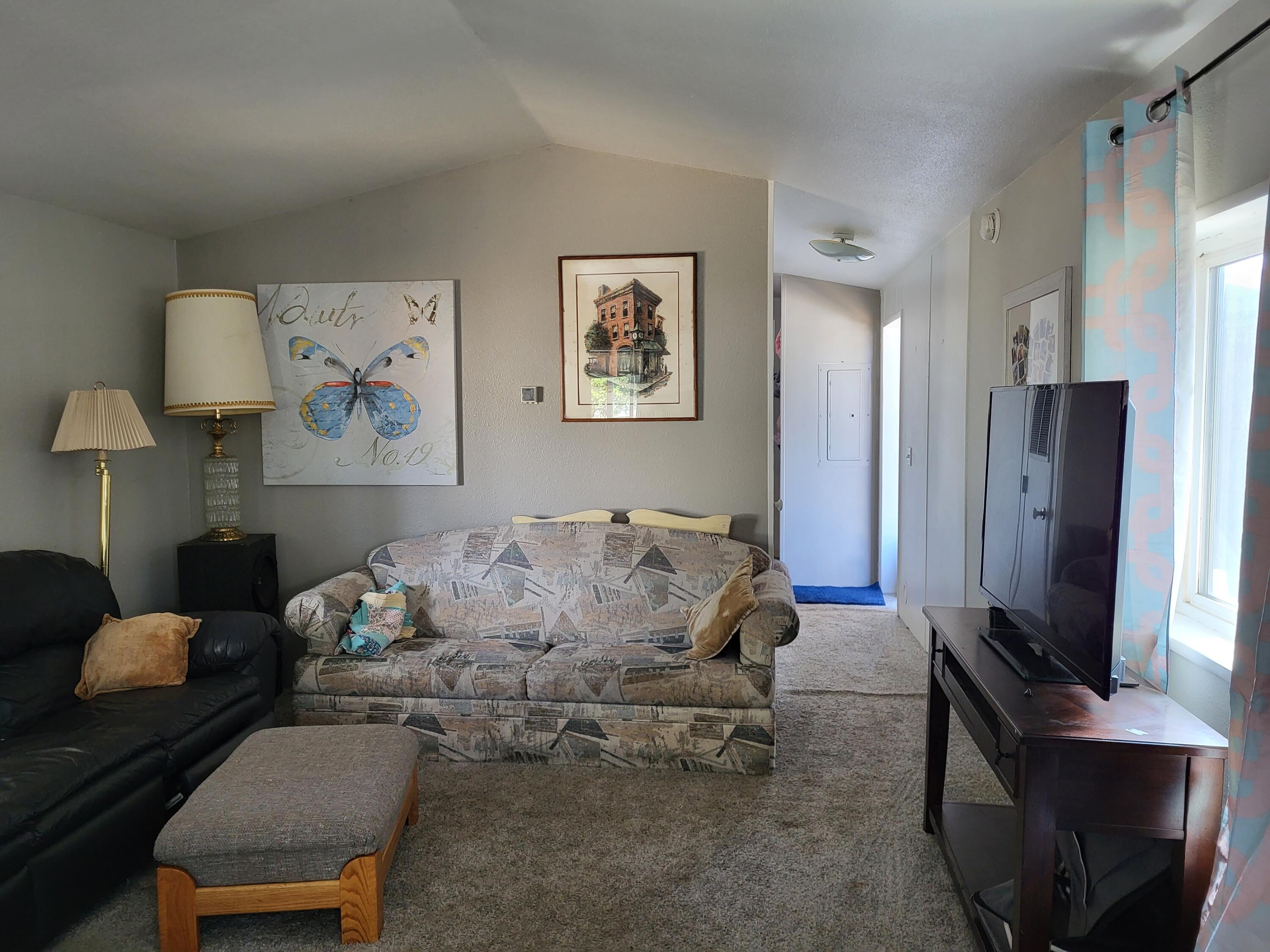 Right down street from the Rogue River and Gold Hill sits this quiet family park with LOW space rent of approx 470. !!!!  1997, 2/1, with metal roof, drywall interior, laminate flooring and an extra office/bonus rm.  Good-size parking area with carport.