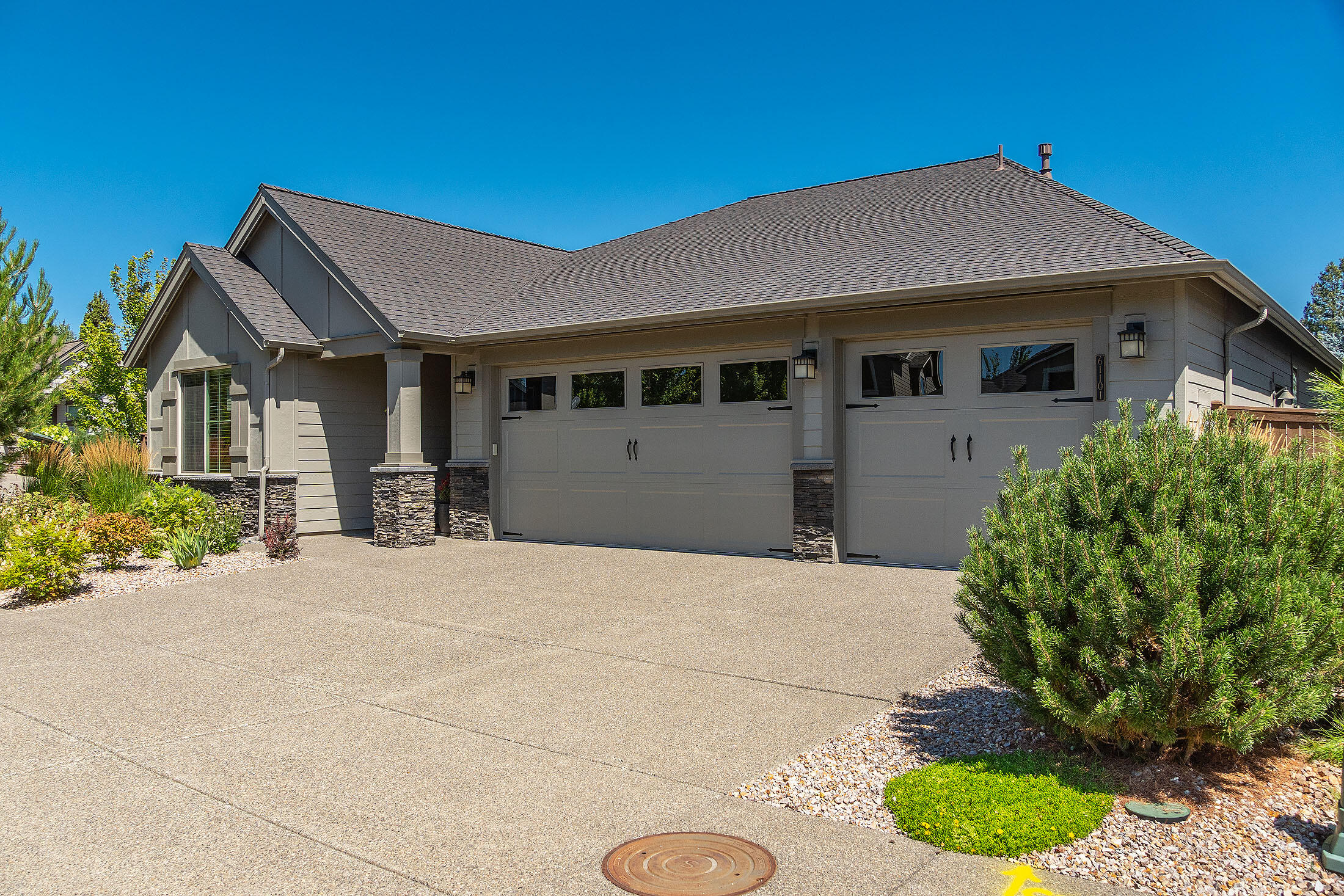 Nestled in The Bridges, this Pahlisch built single level, 3-car garage home sits on a xeriscape corner lot. The community features exceptional amenities including a clubhouse, fitness center, sport court, pool/hot tub and acres of walking paths. The open floor plan, expansive windows, 8' doors and vaulted ceilings show the beauty of this well maintained home. The kitchen is spacious with a large island w/quartz counters, walk-in pantry and ss appliances. The great room has built in cabinetry and a large stone fireplace. The primary suite has coffered ceilings, a walk in closet and an en-suite w/ dual sinks, a soaking tub and spacious shower. The secondary rooms are located in the front of the home allowing for separation of space. The east facing back yard offers a covered patio, pavers and xeriscape. The shed provides extra storage for all your needs. The exterior of the home was painted this year. Situated across from 32- acre Alpenglow park, this is your place to call home.