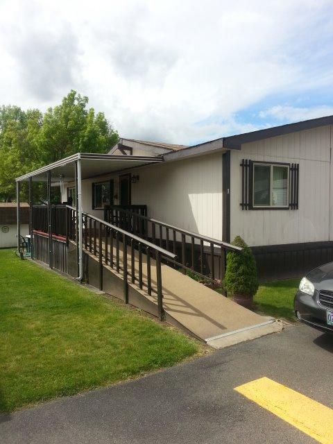 Pride of Ownership!! Shows in this well maintained 1982 doublewide mobile home. Setting on a beautiful corner lot, allows for space and privacy. New thermal windows, new roof, and water heater have been recently installed. Vaulted ceilings and spacious rooms allow for light and airy living in the friendly park that is close to everything in Grants Pass has to offer. There is a handicapped ramp for easy access to a deck, ready to enjoy the Summer evenings. Two pets are allowed, under 25# and rent for the space is $425.00. This home is ready to move into.
