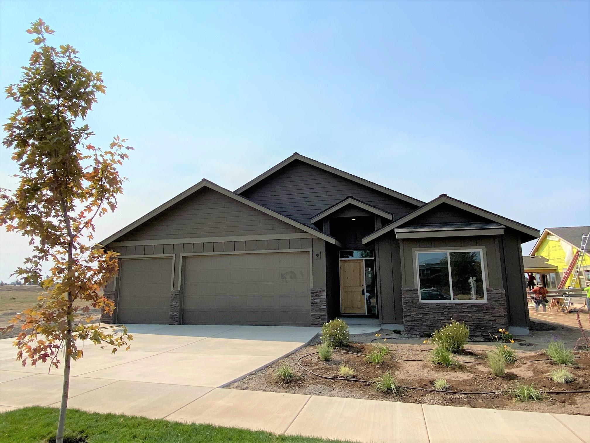 Situated in NW Redmond, this gem is Brand NEW & just completed w/premium finishes throughout. Single level, Great Room concept w/gourmet style kitchen, huge central island & Quartz counters thru out. Full height tile back splash, Stainless Steel appliances. Waterproof Plank style flooring in main living space. Custom wrought iron & modern ledge stone surround on gas fire place, built in TV & entertainment system spaces. Luxurious Master Suite w/tiled floors, Quartz counters, tiled shower w/glass door & walk in closet. Spacious walk in pantry, laundry room w/cabinetry. Art niches, ceiling accents, custom window coverings available. Oversized garage & extended drive way to accommodate larger vehicles or toys! Landscaped, covered back patio, sprinklers & A/C installed too. Back yard borders the Dry Canyon park. Call for details!