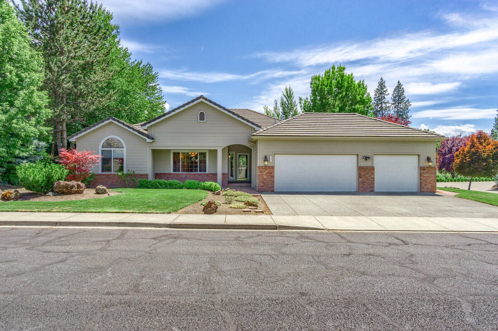 Located In the Fairway Ridge subdivision, a stone's throw away from the Eagle Point golf course, this beautiful home is 2323 sqft w/ 3 beds and 2 baths on a .28 acre lot w/ a concrete tile roof. This single level home features a split floor plan with hardwood flooring in the living room, kitchen & formal dining room, 9ft ceilings with coffers creating a grand atmosphere. The primary bedroom is spacious & features heated bathroom floor, custom tiled shower, & direct access to the back patio. In the kitchen there are tiled granite countertops, stainless steel range, pullout drawers, & another door to the back. The family room feels open w/ built-in cabinets, the formal dining room has plenty of space for your table & the living room has access the back patio. A 3-car garage with pull down storage & tons of cabinets has plenty of space for your cars & tools. There is a covered entry in the front & covered patio in the back w/ drip system & timed sprinklers with 2 additional storage.