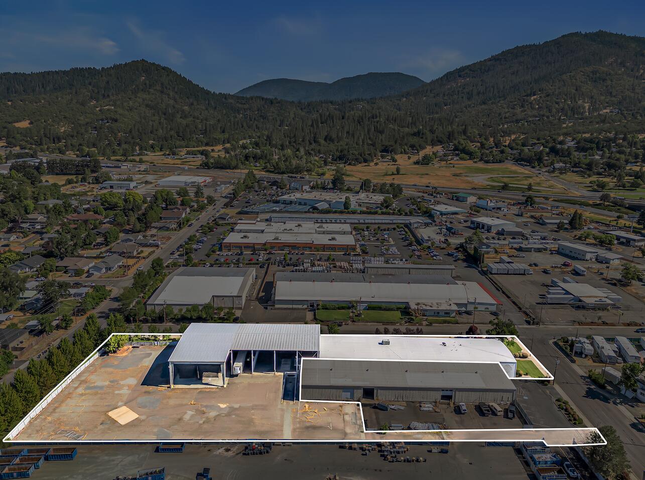 We exclusively present for lease, 1990 NW Washington Blvd. Situated in North Grants Pass, the Property consists of approximately 12,200 SF of interior warehouse with 11,800 SF of covered dock / storage and ±6,000 SF of professional office. The warehouse features fire sprinklers, 3-Phase electrical supply, two ground-level doors with one accessing the covered dock area. In the front of the building sits office consisting of lobby, several private offices, a break room, server room and restrooms. Also available for sale. NNN. Contact broker for details.