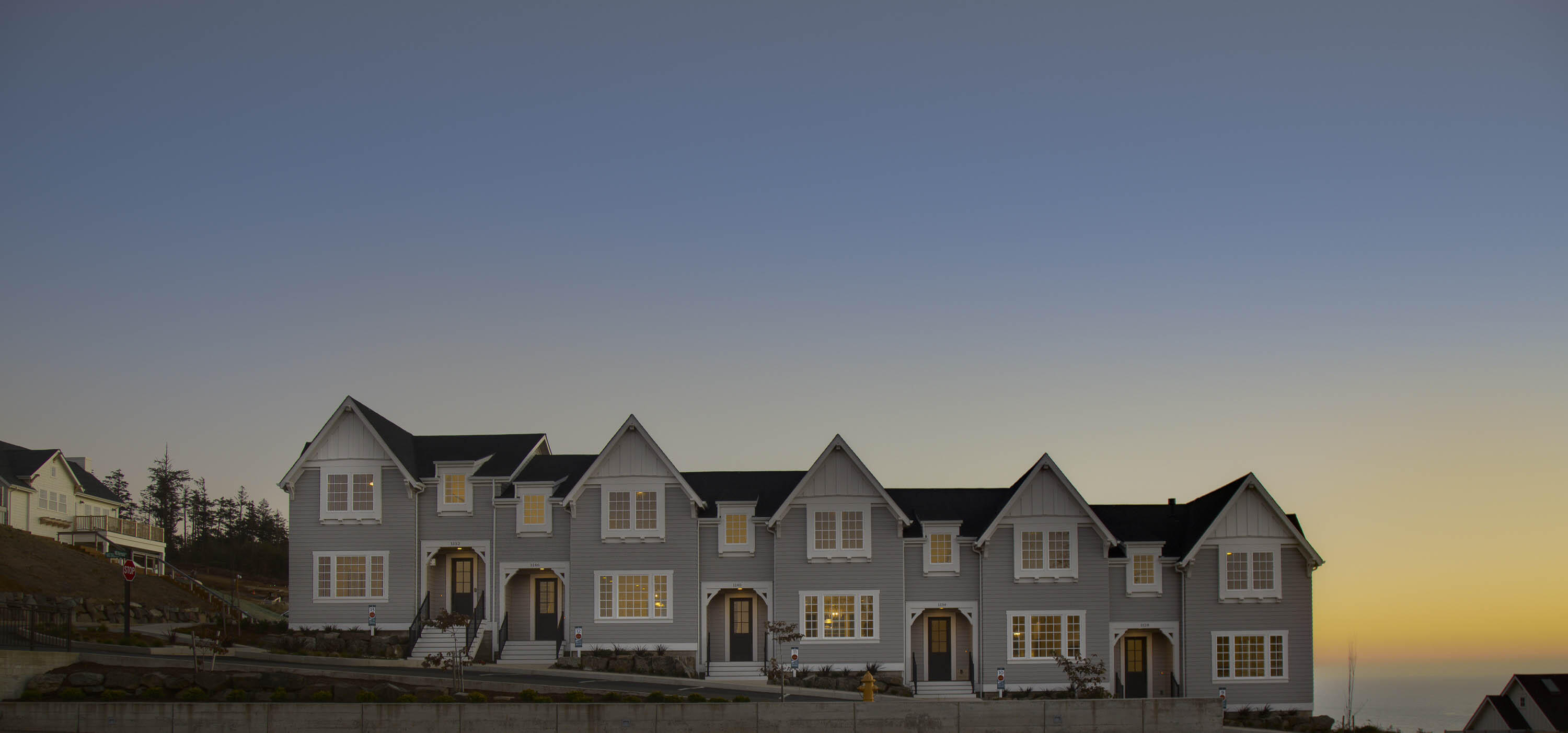 Searching for a townhome with panoramic ocean views and short term rental eligibility on the Oregon Coast? Townhouse 9 at Depoe Hills provides huge western and southern exposures that capture the pacific coastline in all of its beauty. This end unit is ideally positioned to take full advantage of natural light and ever changing vistas, all across the street from the community plaza. The main level features a spacious open concept living area that connects kitchen, dining, and lounge spaces, while upstairs, a generous primary suite is accompanied by two additional bedrooms and is perfect for guests, remote work, or a media room. With exceptional storage, oversized garages, and thoughtful floor plans, these townhomes are designed to accommodate both full time living and income producing potential. Preferred lender credit available at Closing, please inquire for details. Rental projections are available as well.