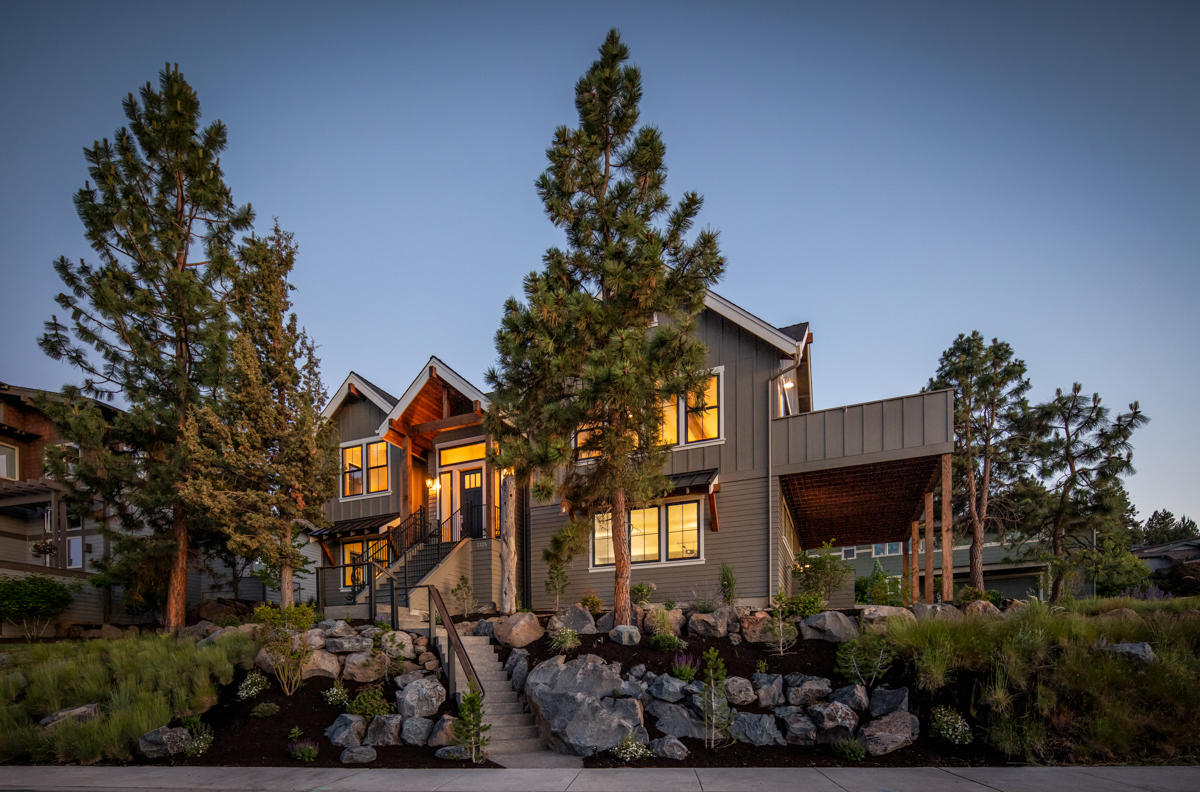 Come enjoy life in this incredibly well designed home with unobstructed mountain views. 24 feet of windows, including the wood Anderson sliding doors take you out of the great room & into the stunning vistas to the north & east. Bask in the beautiful Bend summer nights on the large private deck, which ties the outdoor views to the interior of this stunning residence. This one checks all of the boxes with the finest in today's finishes. Relax in the master bath with raised tub or unobstructed entrance to the fully tiled shower. All appliances, as well as the 86'' 4 K TV are included, so you are ready to move in immediately. Separate lock off unit downstairs, including kitchen, allows for parking in the driveway & easy single level access. The large driveway can accommodate your RV and up to eight cars as well as the garage having ample room for your vehicles, along with the toys, boats & dirt bikes essential to the Central Oregon lifestyle. Rear garage entries in the neighborhood.