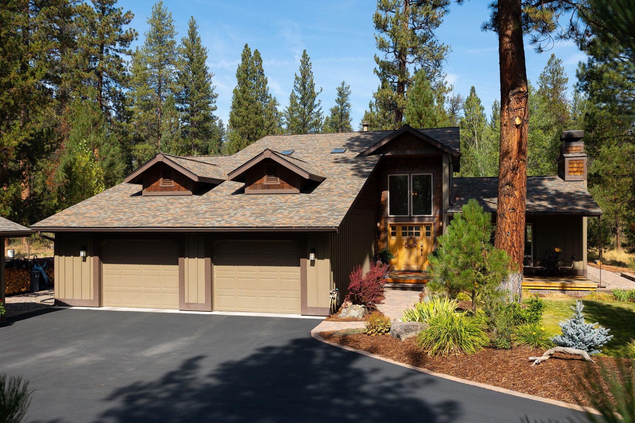 Presenting two old-growth forested parcels, a 3/4-acre breathtaking setting for this 3BR/2BA custom home, doorway to Nat'l Forest and Big Deschutes River paradise!  Rich NW elements, true to the woodland setting, inc. 100-yr-old white oak plank floors, vaulted T&G cedar ceilings, shaker-style knotty alder cabinets & doors, ironwork stairway detail + barnwood accents milled from historic NW barns.  Earth-tone slate entry leads to a sunlit great room and an impressive floor-to-ceiling Montana bitterroot stone fireplace.  Dining area opens to expansive deck + pine forest, then to upscale granite cook's kitchen w/Wolf cooktop/dbl ovens, built-in refrigerator + prep island.  Stunning primary suite fills the upper level w/mixed wood species, ebony Brazilian stone heated floors, pebble-accent tiled shower & vanity, luxury soaker tub + fireplace.  Treed 2nd lot offers a peaceful blank canvas for a future dream shop. Wander on scenic nature trails, steps to the Big Deschutes River and beyond!