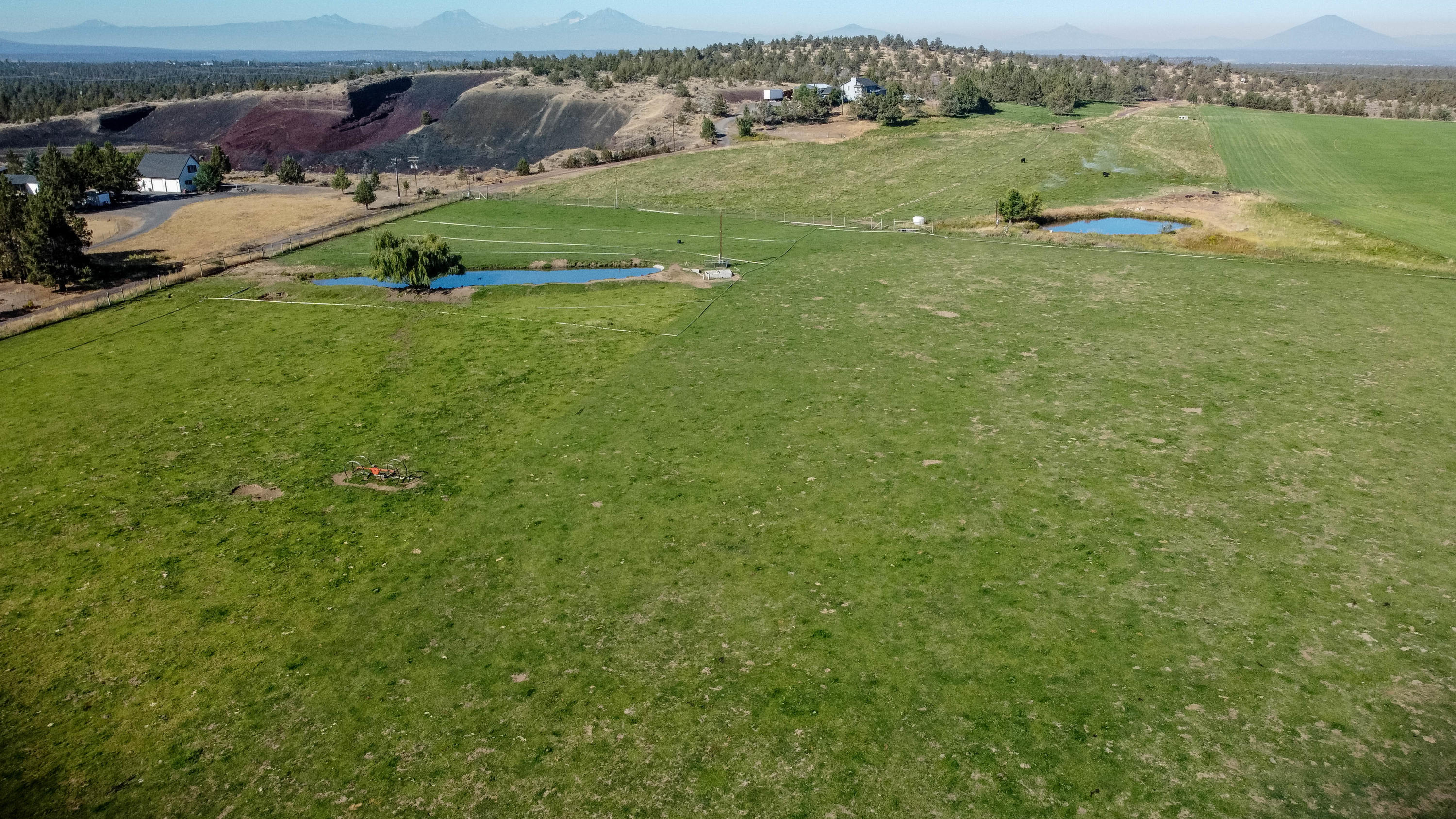 Only minutes from Redmond, 14.76 pristine acres of Terrebonne farm property with 13.43 acres of Central Oregon Irrigation water rights and nine acres in alfalfa hay. Located in Terrebonne valley, farm this irrigated property now! Stunning views of Smith Rock and the Cascade Mountains. Irrigation equipment included in the sale - see attached docs. Conduit set for power, phone, cable and computer lines. Not buildable at moment. Purchaser to do all due diligence to get a CUP in place to build on said property. Fenced for animals, large pond - great long-term investment.
