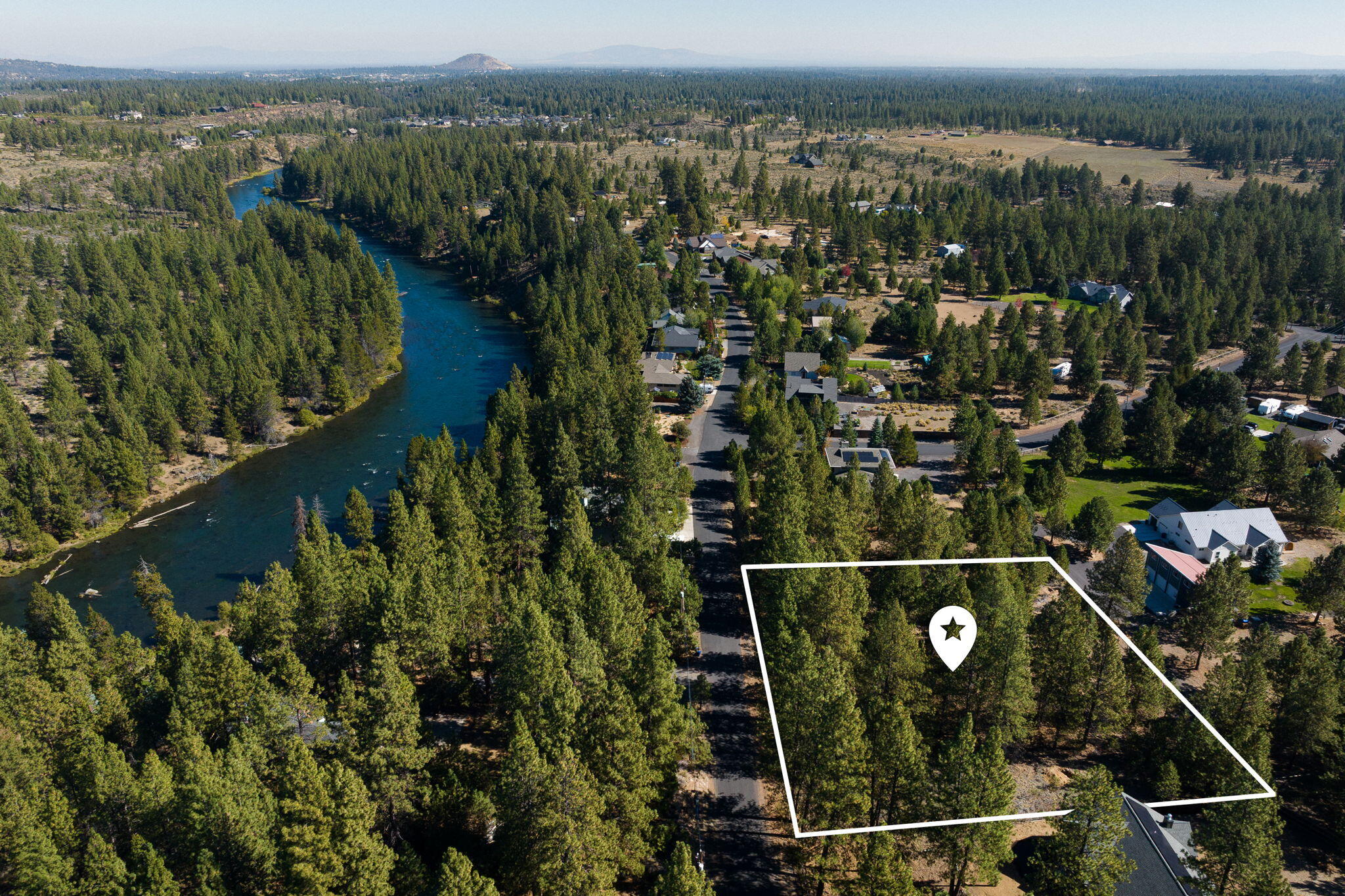 The 1.27 acre property comprises 3 adjoining lots and is located just a few miles south of the Bend city limits in the sought after neighborhood of River Bend Estate on the Deschutes River.   River Bend Drive is a quiet street of beautiful homes within close proximity to all of the amenities and services Bend has to offer.  The property would be a perfect fit for a builder of fine homes and includes two .43 acre building lots, each with septic approval, and a third lot that is a .40 acre property, which although not septic approved, would create a more expansive setting for added privacy when combined with 60648 River Bend Drive.