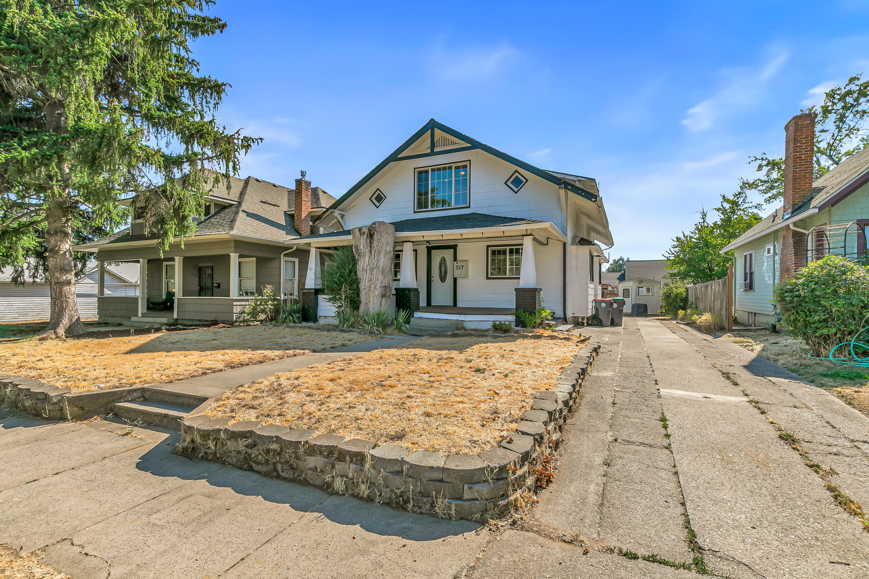 Versatile two-home property in SW Medford presents a unique opportunity for both owner-occupants and investors alike - centrally located within five minutes of Providence Stewart Meadows Medical Center, Cartwrights Market, and Fichtner-Mainwaring Park! Front home at 517 Newtown Street includes main-level primary with full ensuite bathroom, formal dining and living room with fireplace and box beam ceiling, kitchen with solid surface counters and stainless appliances, vinyl plank flooring, three upper-level bedrooms and full bathroom, plus an expansive ~800 SqFt lower level with carpeted media room or office, laundry hookups, and ample storage. Back home at 746 W 14th Street with separate alley access and fenced yard, living room, full kitchen with granite tile counters, two upper-level bedrooms, and full bathroom with stacked washer dryer. Detached workshop shed with electricity. Closing cost assistance available to Buyer(s) with acceptable offer. Inquire for details!