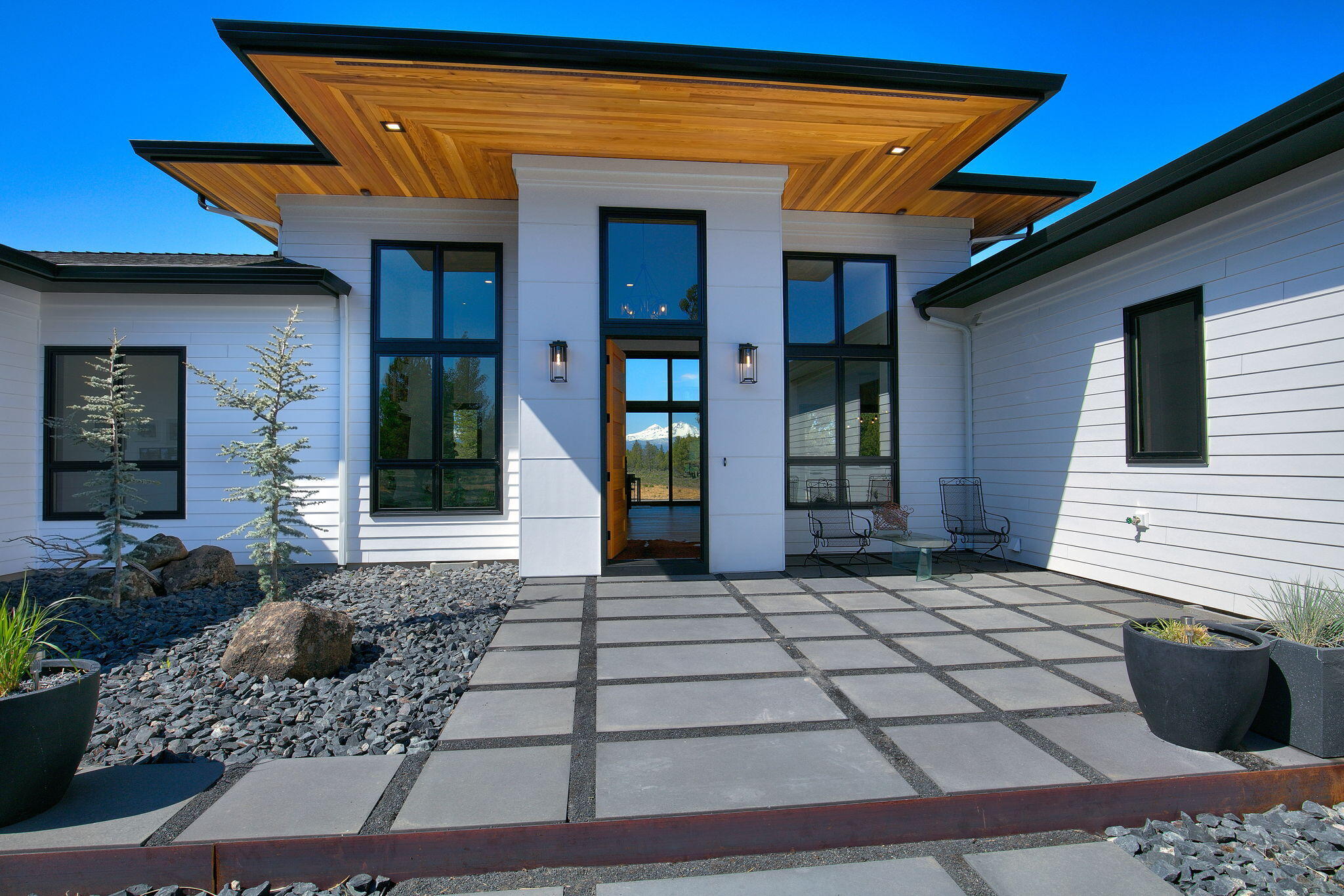 The perfect location just ten minutes from Sisters, panoramic full mountain views, situated on carefree low maintenance 80 acres backing to BLM land with access to an extensive trail system to run, bike, or hike with access to Mckenzie Canyon and Deep Canyon right out your front door. In this NW Modern home your breath will be taken away by immaculate views of the Three Sisters framed by oversized windows off the living area. This custom built home took every detail into consideration and is truly one of a kind. Additional upgrades included, solar panels, whole house back-up generator, pole building, electric car charger, whole house water filtration, and so much more. Your family and friends will be easy to entertain with a kitchen that holds top appliances and boasts double islands. High ceilings and doorways in every room. On those summer nights dine outside with unobstructed views of the Three Sisters and Mt Jefferson. Experience the pinnacle of luxury living in Central Oregon.