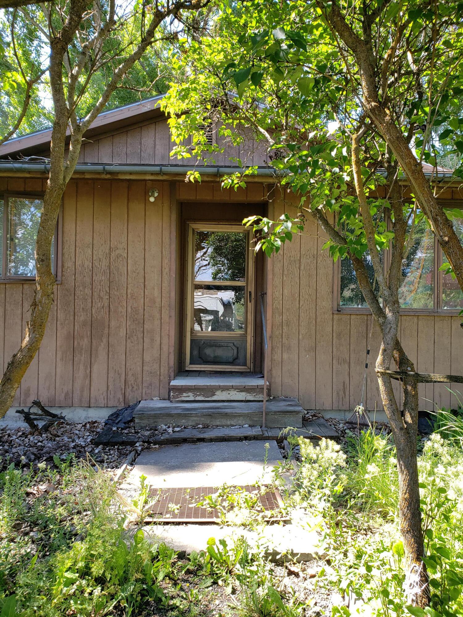 Rare opportunity for homeownership in Fossil! This sturdy little home is two bedroom, one bathroom, open living and kitchen area, and has a large bonus room. The house has baseboard electric heat, a monitor heating stove, and potential for a wood heating stove.  The oversize lot is .27 acres and has lilac bushes, established shade trees, extra room for a garden, the creek running through it, and tons of privacy for an in town home.