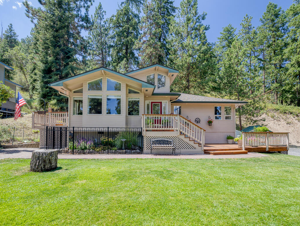 Beautifully maintained home with a peekaboo view of Klamath Lake, offering elevated privacy. Pride of ownership is evident both inside and out. The main living area welcomes you with vaulted ceilings & large, tall windows featuring built-in seating, perfect for soaking up the morning sun. The open concept layout allows a seamless flow into the kitchen & dining room. The Primary Suite is located on the main level & features a soaking tub embraced by windows that invite soft natural light.  Also on the main level is the second bedroom and a charming full bath. Downstairs offers a spacious second living area, anchored by a stunning gas fireplace with a custom mantle, a full bathroom with a laundry area that provides functionality, & a generous third bedroom. Recent upgrades include a new Roof in 2024, a new Septic System in 2019, all new appliances in 2024, several replaced windows, & a concrete parking pad. This home blends thoughtful updates with comfort and charm in every corner.