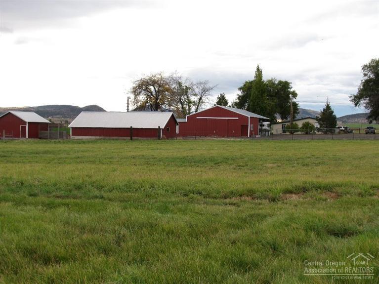 Over 15 acres of Deschutes Water Rights that uses gravity flow irrigation, four out buildings, and a cozy home that is priced well.