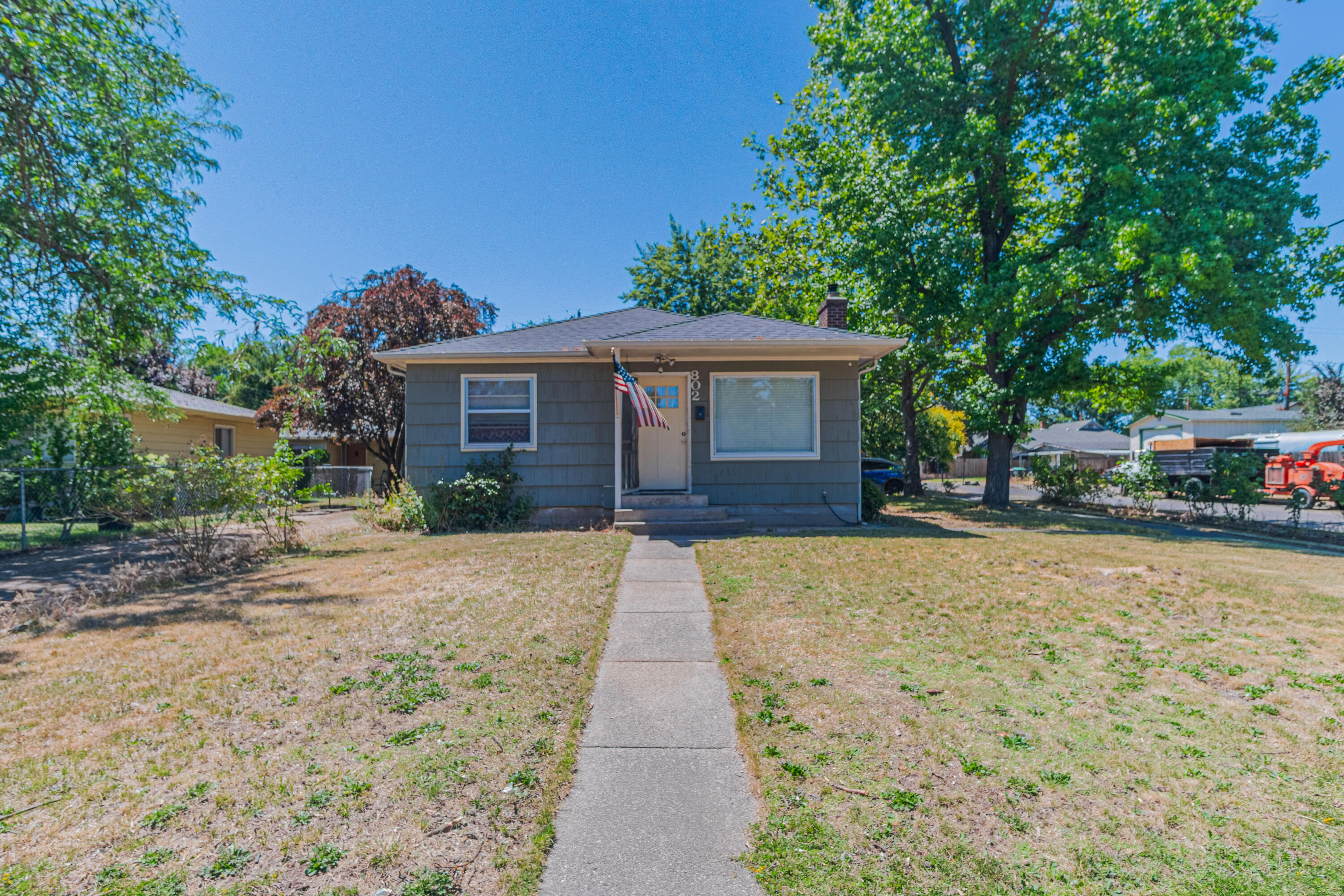 Welcome to this charming home built in 1953 and located in an established southwest Medford neighborhood. Situated on a spacious corner lot, this 3-bedroom, 1-bathroom home features many updates and offers a unique bonus in the form of a converted garage that serves as a versatile fourth bedroom, home office, or guest space. This space also has its own private entrance for easy access, privacy and convenience.

The living room has hardwood floors and a wood burning fireplace for those chilly winter nights. The kitchen is open and perfect for family meals and entertaining The other 3 bedrooms are nicely sized and provide both privacy and ample closet space.

Enjoy outdoor summer activities with an above-ground pool — perfect for splashing around on those hot summer days or hosting backyard gatherings. The backyard also offers room to garden, play, or just relax in your private setting. 

Don't miss out on this one, schedule your showing today!