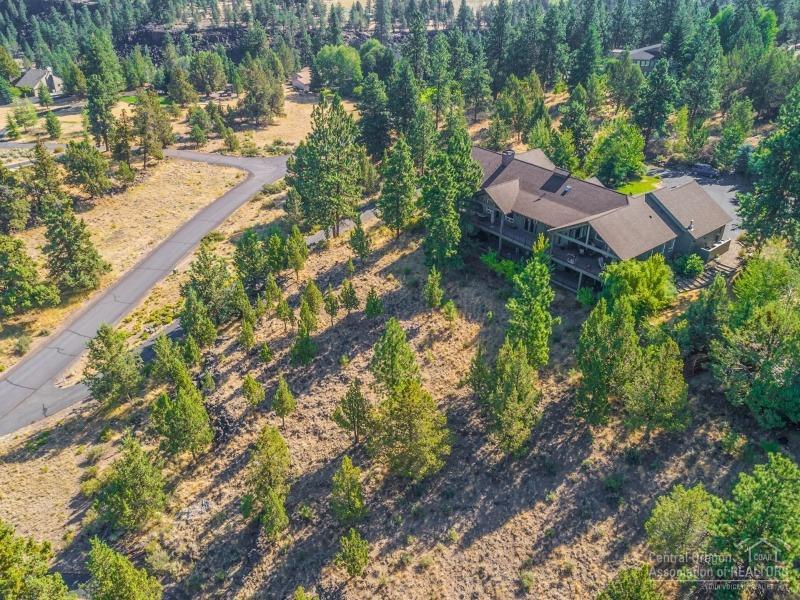 2.41 Acres with Private Setting and Full Cascade Mountain Views. Property backs up to Deschutes River Trail and overlooks beautiful Awbrey Meadows common space. Home features 2-living areas, gourmet kitchen, lots of windows throughout, office with fireplace and extensive outdoor living. Master bedroom has fireplace, soaking tub, large walk-in, sauna & steam shower & private deck with hot tub. Plenty of storage space with, 3-car garage plus lower level garage.