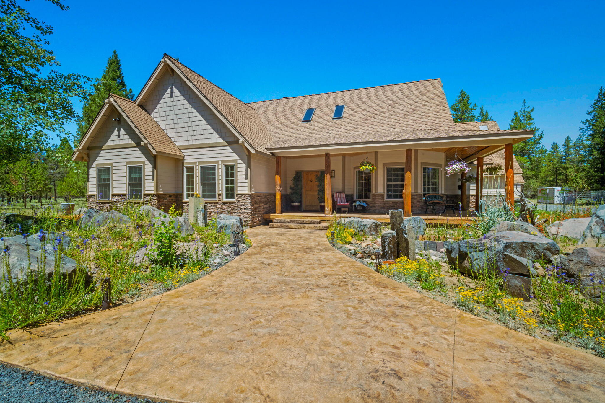 Escape to your own private retreat on nearly 15 acres of pure nature, recreation, and relaxation! This one-of-a-kind property offers something for everyone! Inside, you'll find 3 spacious bedrooms, office, plus a bonus room complete with a built-in wet bar~perfect for hosting! The great room features a stunning floor-to-ceiling wood-burning fireplace, hickory hardwood and slate flooring throughout. The kitchen is beautifully appointed with hickory cabinets, granite countertops, quality finishes and formal dining room. Step outside to your own outdoor oasis featuring a custom-built kitchen with BBQ, a relaxing hot tub surrounded by decking, stamped concrete patio, a 240-yard golf driving range, and a private trail that winds around the property. High-speed CAT 6 networking is already in place for all your modern needs. Located just minutes from Mt. Bachelor, the Deschutes River, and endless outdoor adventures, this property truly offers the best of Central Oregon living!