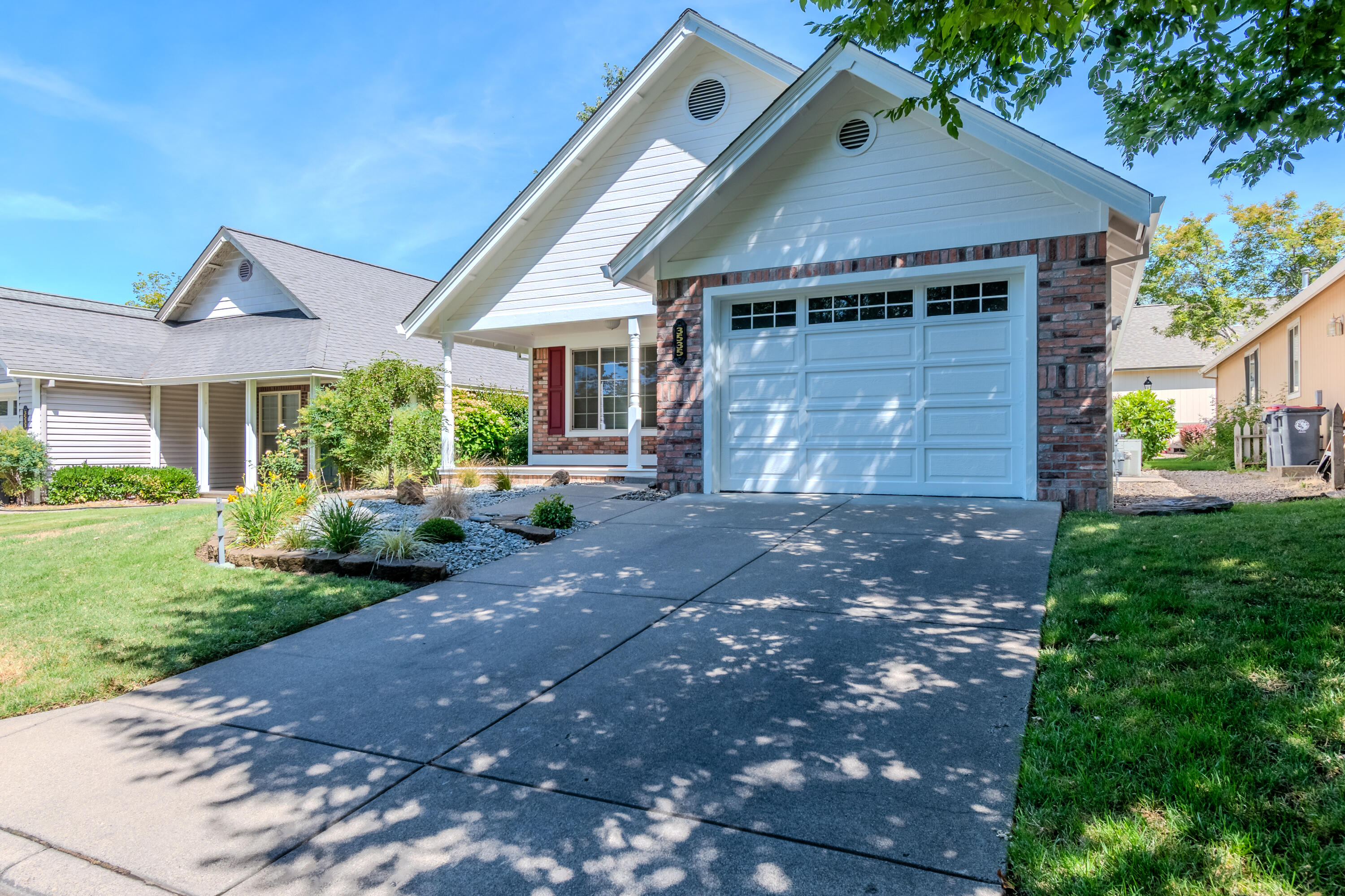 Welcome Home... Freshly painted exterior with move in ready interior /turn key ready to go! Discover refined living in this 1,444 sq ft East Medford home in prestigious Country Club Village Estates. This thoughtfully designed 2-bed, 2-bath residence features an inviting open floor plan with impressive high ceilings that create an airy, spacious atmosphere. The welcoming living room boasts a beautiful gas fireplace that serves as both a stunning focal point and cozy heat source. Enjoy spacious bedrooms including a master suite with luxurious bathroom. The property includes a convenient 2-car garage and is ideally situated in one of East Medford's most desirable neighborhoods. Experience the perfect blend of comfort, quality and location in this exceptional Country Club Village Estates home.