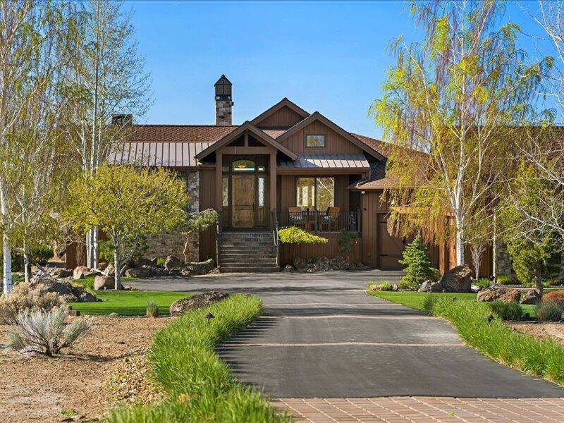 Excellent opportunity to live on the golf course, while enjoying privacy.  Quality construction at $453 psf.  You need to see to appreciate the craftsmanship.  Situated on a 3/4 acre lot overlooking the 15th fairway of Brasada Canyons Golf Course. A custom-built masterpiece featuring beautifully crafted wood radius beams, hand hewn oak floors and custom designed stair rail, this home combines timeless elegance with modern functionality. Two identical primary ensuite bedrooms on each level with fireplace, walk-in shower, ample closet space, jetted tub and double vanities. Lower floor includes spacious family room with fireplace. 200 bottle capacity wine cellar with wet bar, making this the ideal space for both intimate gatherings or grand celebrations. In addition the lower level offers a 2nd bedroom and tons of storage space. Outdoor kitchen, hot tub and 2 water features create the perfect setting for outdoor entertaining.