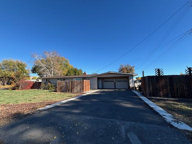 3 bedroom home in suburbs with updates in 2019 including: roof, flooring, fixtures, bathroom and more. Home is close to schools and shopping.  This property has a large, fenced yard, parking in driveway and on side of the home. There is a certified wood stove for those cold winter days.