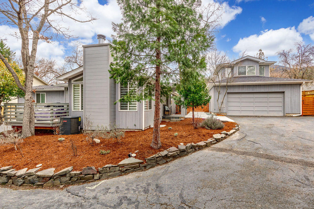 A True Gem. Stunning remodel home Close to Downtown Ashland.  Total Sqft is 2440.  Main house 1918 sqft 3 bdrm 2bath, plus accessory living space-- a  Detached 1bdrm 1 bath 234 sqft quest quarters, and a  288 sqft  office/studio over the garage Total sqft is 2440 sqft. Main house features Great Room, vaulted ceiling, fireplace, all new floor coverings, totally new kitchen, custom cabinets, quartz counters & backsplash, newer appliances, subzero frig.  Master is a dream come true, oversized walk-in closet, ensuite bath dual sinks, jetted tub and tiled shower. Hall bathroom has tub & separate tiled shower, granite counters.  Dining rm & 2 bedrooms.  Great backyard, lg deck, dble garage(drive through).  2 decks.  .31 acre flag lot with room to park 4 cars and even an RV.  Professionally landscaped, auto sprinklers.  Detached quest quarters-234 sqft w/ full bath, kitchenette, private parking and fenced courtyard. Bonus room over garage-272 sqft for office or crafts with  deck and views