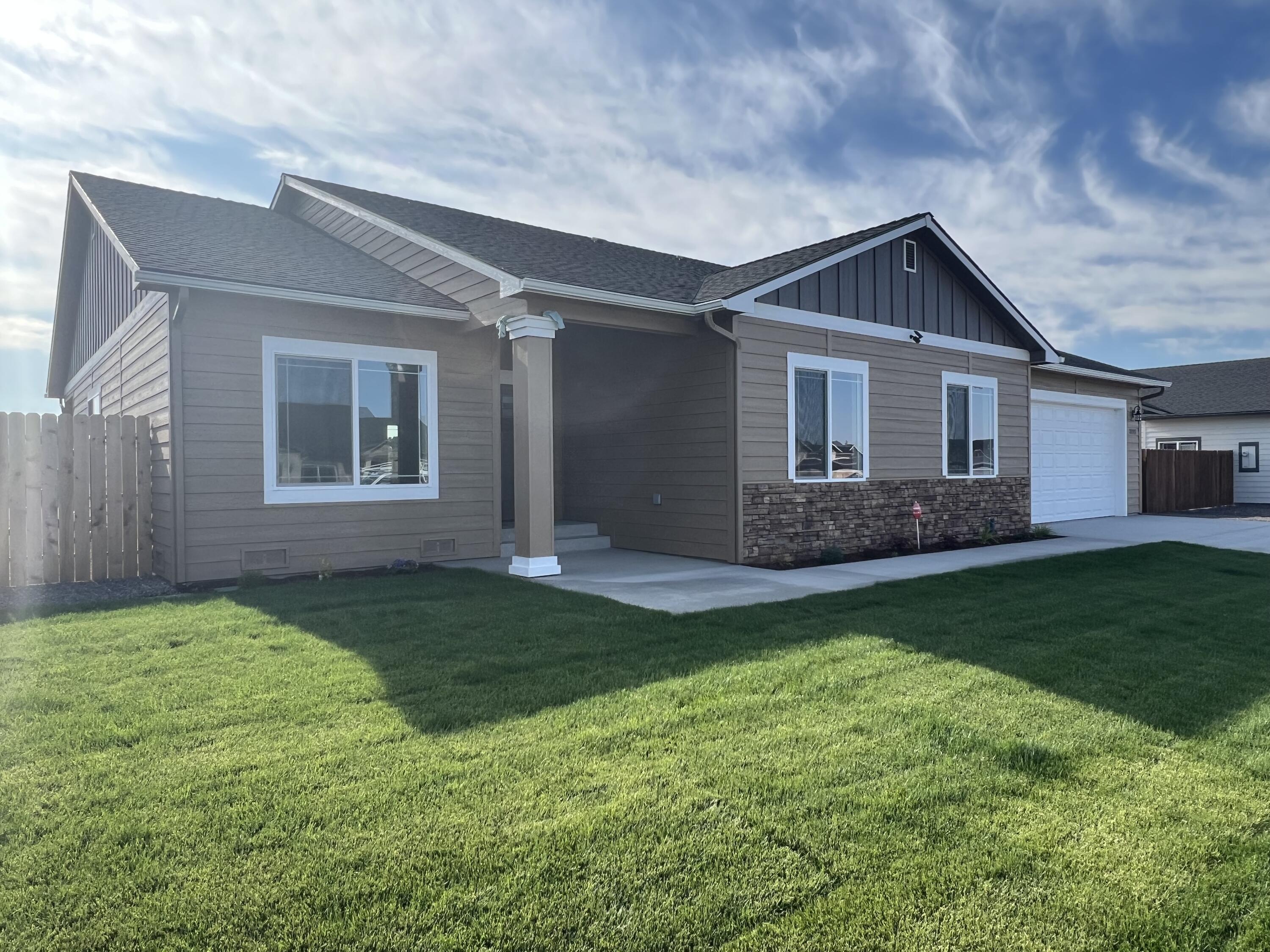 Here is another Tom Soyland built home in the desirable Sunset neighborhood with other Soyland quality-built homes. Both Front and Back Yards have been fully landscaped and have  a fully timed watering system.  This semi-custom home provides a split floor plan that separates the large master suite from the other 2 sizable bedrooms. The master bedroom has a large master bath with oversized shower plus an oversized deep soak tub and a walk-in closet. The home provides 2197 Sq ft of inside living space and the covered area is 256 sq ft. The garage is an enlarged 2 car garage with an expanded shop/storage area, giving you over 700 sq ft of garage/shop area. The garage even has a pull-down attic ladder for additional attic storage. Granite counters and custom cabinetry that reach all the way to the 9' ceilings are very impressive and the coffered ceilings in the dining, kitchen, office and master bedroom really give this home a special look.