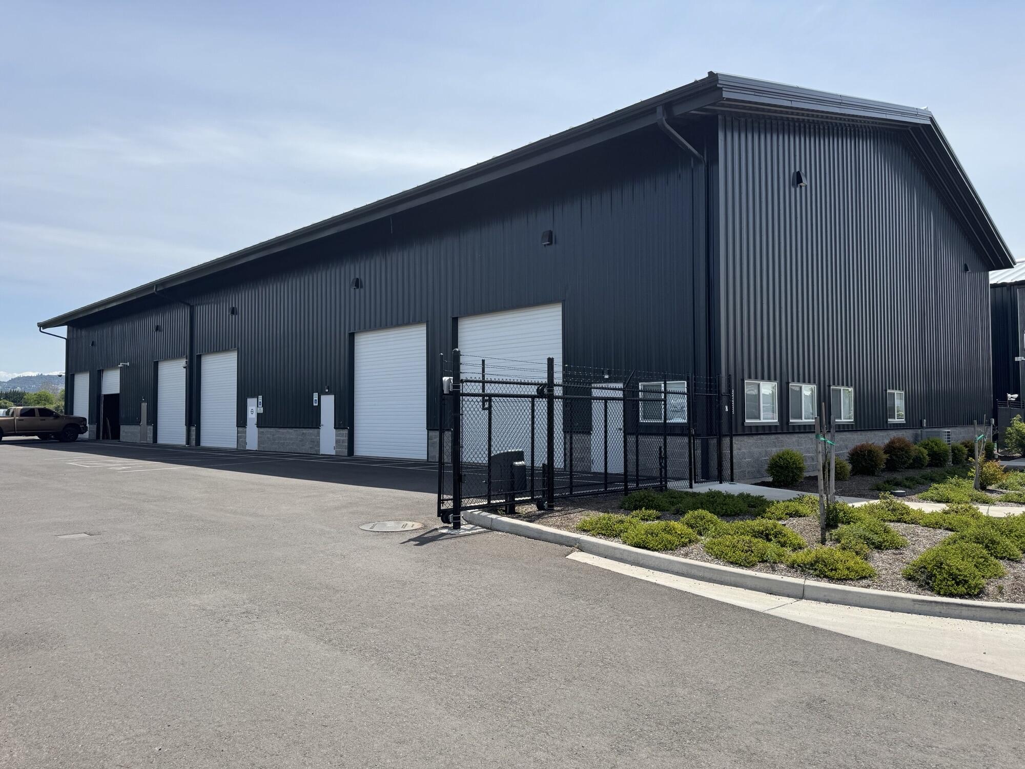 High quality industrial space located in a newer multi-tenant development just North of the Rogue Valley Airport. This approximately 4,500SF space includes two grade-level roll-up doors, high clear span ceiling, gas space heaters, and quality office improvements. Property improvements include a fully fenced lot with secured access and paved parking. Owner will consider additional improvements for qualified tenant.