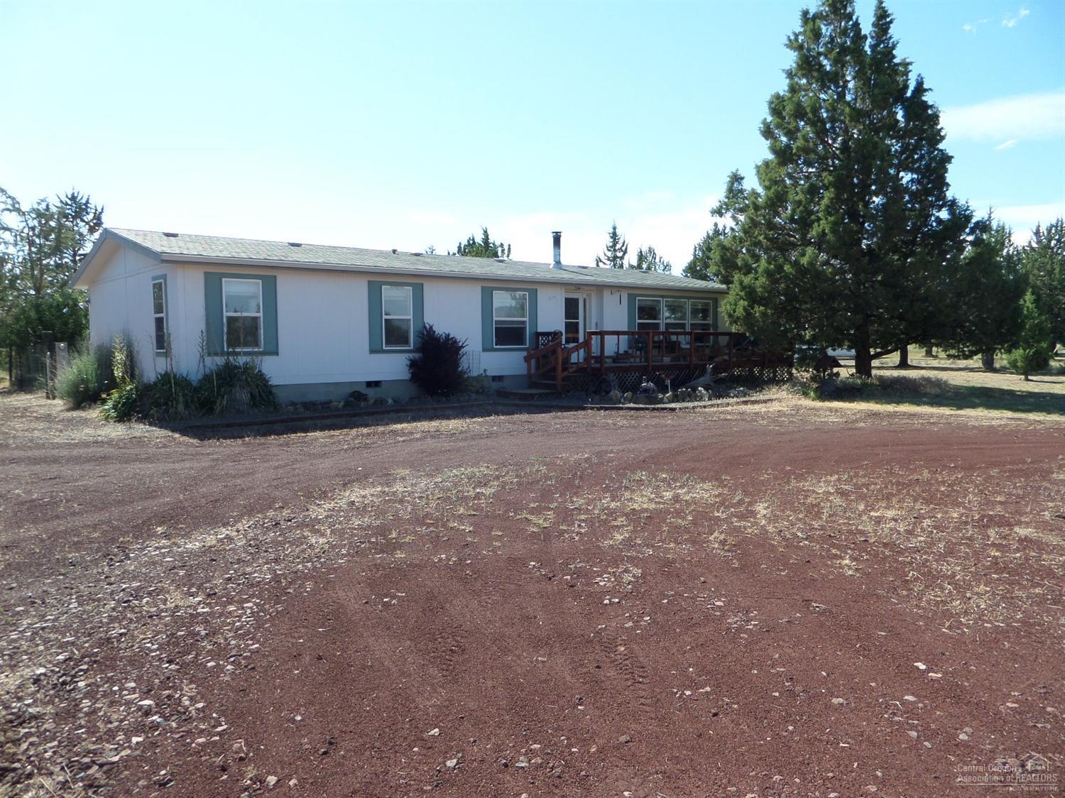 This one wont last long! Very attractive 3 bed, 2 bath large open living room. Kitchen area with lots of oak cabinets, recess lighting in the kitchen and bedrooms. Wood stove to keep you warm In the winter front and back decks. Located in a nice area on 2.14 acres. 10x10 shed and additional smaller storage building. Come enjoy all the Ranch has to offer-golf, fishing, hiking and more!