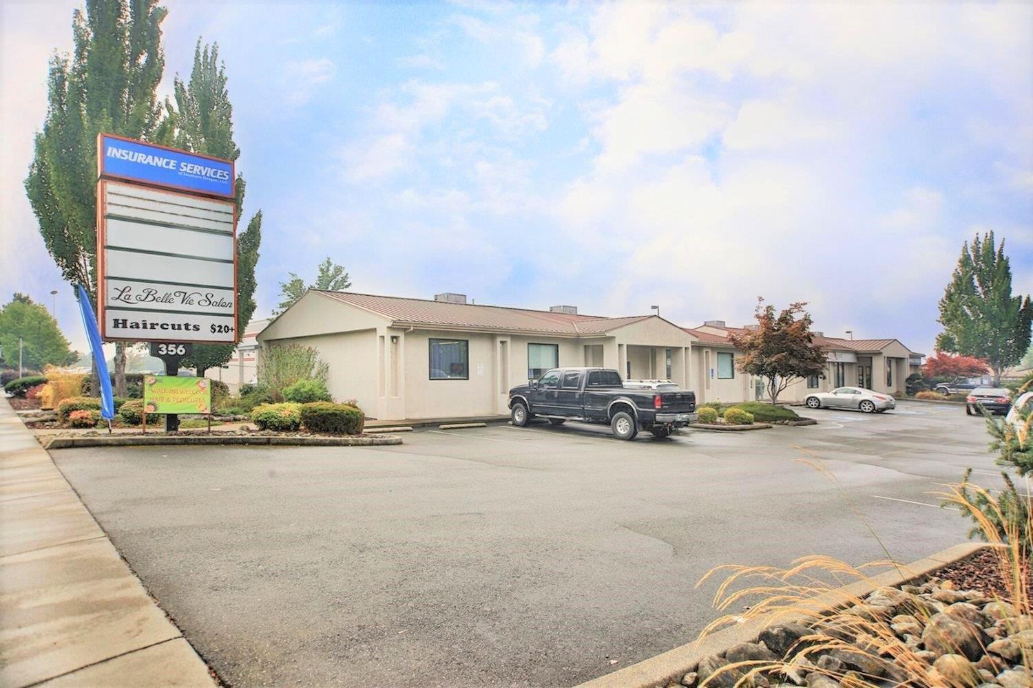 Contemporary office space of 6400 sq ft. Plenty of off street parking. Remodeled in 2017. 2 separate buildings consisting of 3200sf each. First Building Unit A is occupied and rents for $2,110/month. Second building, Unit D&E rents for $900/month. B&C are are vacant and totally ready to occupy. Combined B&C make one 1600sf office with 4 private offices, conference room, private bath, kitchen and large open space. Large office and conference room have sound proofing wall panels installed eliminating any echoing. Plenty of off street parking. Remodeled in 2017. Both owners are licensed real estate brokers in the state of Oregon.