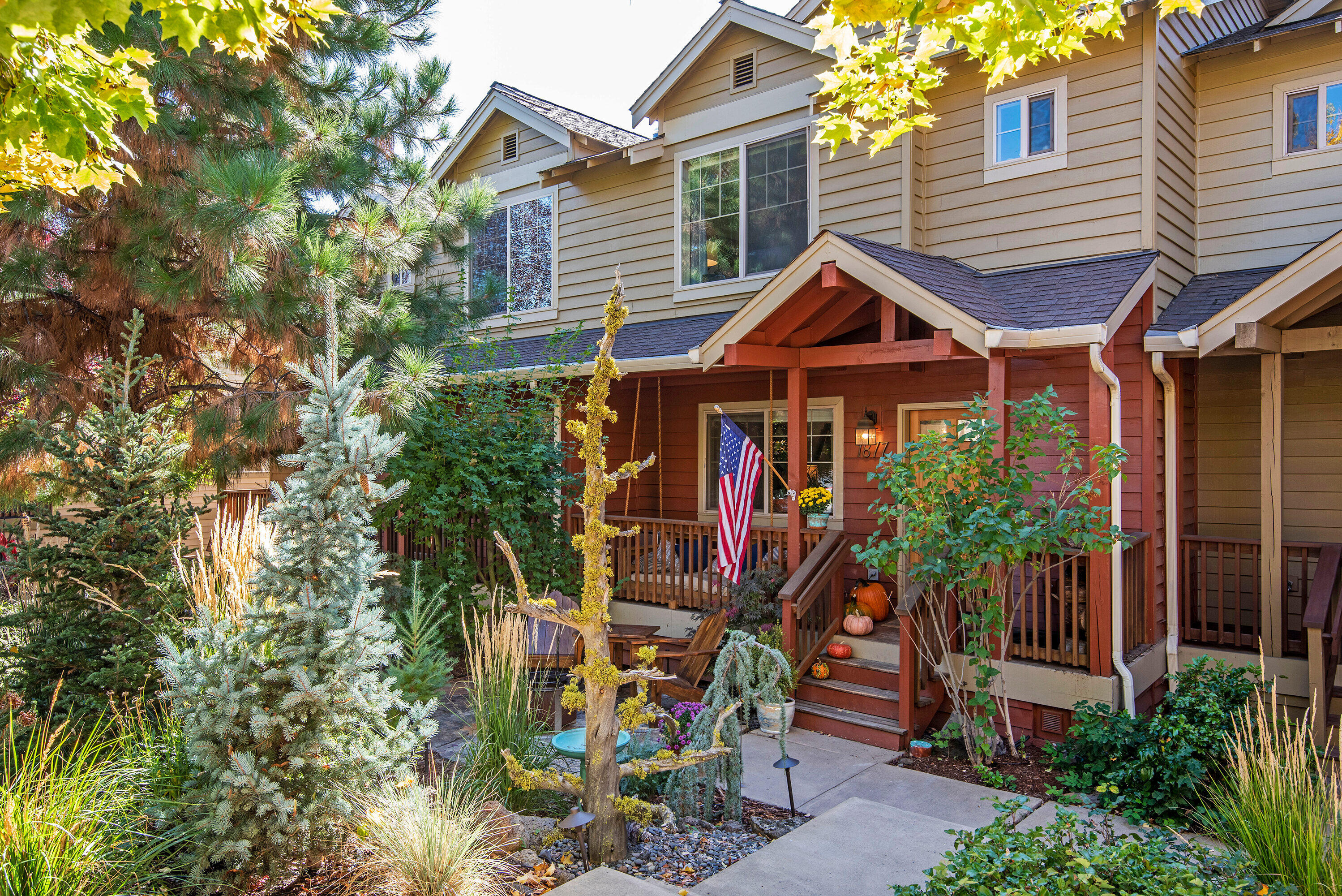 Situated in the heart of Bend's westside, this beautiful townhome is move-in ready & the perfect place to enjoy all that Bend has to offer. One step inside & you will want to call this home! Featuring renovations throughout, many new upgrades & custom amenities. The open great room offers a cozy gas fireplace, built in features, an updated kitchen with eating bar and a sunny deck that includes a gas Weber grill. Upstairs features a large primary suite with a remodeled bathroom including a luxurious new dual spa tiled shower, a walk-in closet and a second primary bedroom with private bath. Downstairs is a large tandem 2 car garage with a workshop area, plenty of storage and room for all your toys. Outside is your own little oasis with a private covered front porch, a flagstone patio with firepit, native landscaping with custom lighting plus out back you will find custom raised garden beds.  Perfectly located close to trails, parks, restaurants and all the westside amenities. A must see!