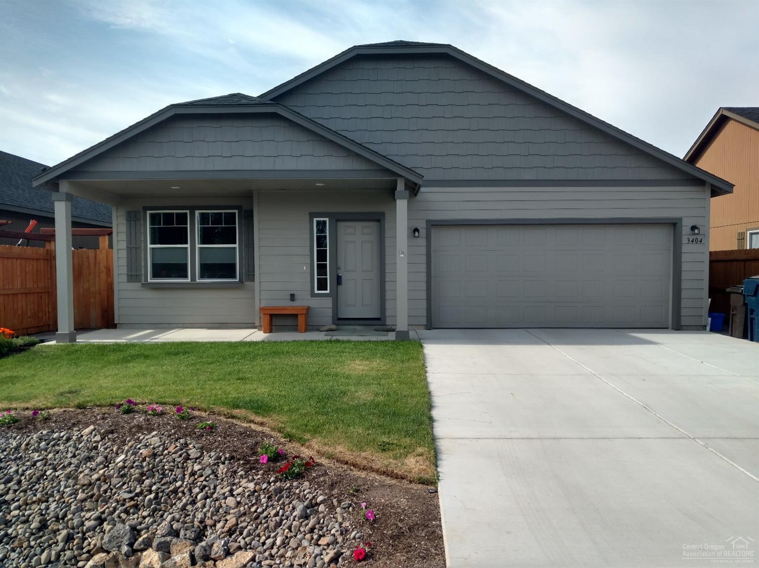 Very clean like new and read to move into 2014 built home in Northwest Redmond. Great room living with gas fireplace and larger entry hall. Spaciously fenced and beautifully landscaped backyard, underground sprinklers, and covered patio perfect for the morning coffee. Roomy master suite featuring a walk in shower, and closet with double vanity. You'll love this home.