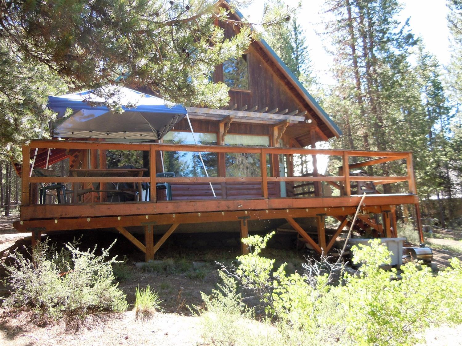 This cabin sits on over 1.5 acres of Crescent Creek frontage. Great location just mile from Crescent Lake Township. Easy access to forest land. Fish, swim or just relax on your deck while feeling the breeze from the creek! Huge 30X40 garage shop. Extra room with bathroom for those guests! Hurry this won't last long!