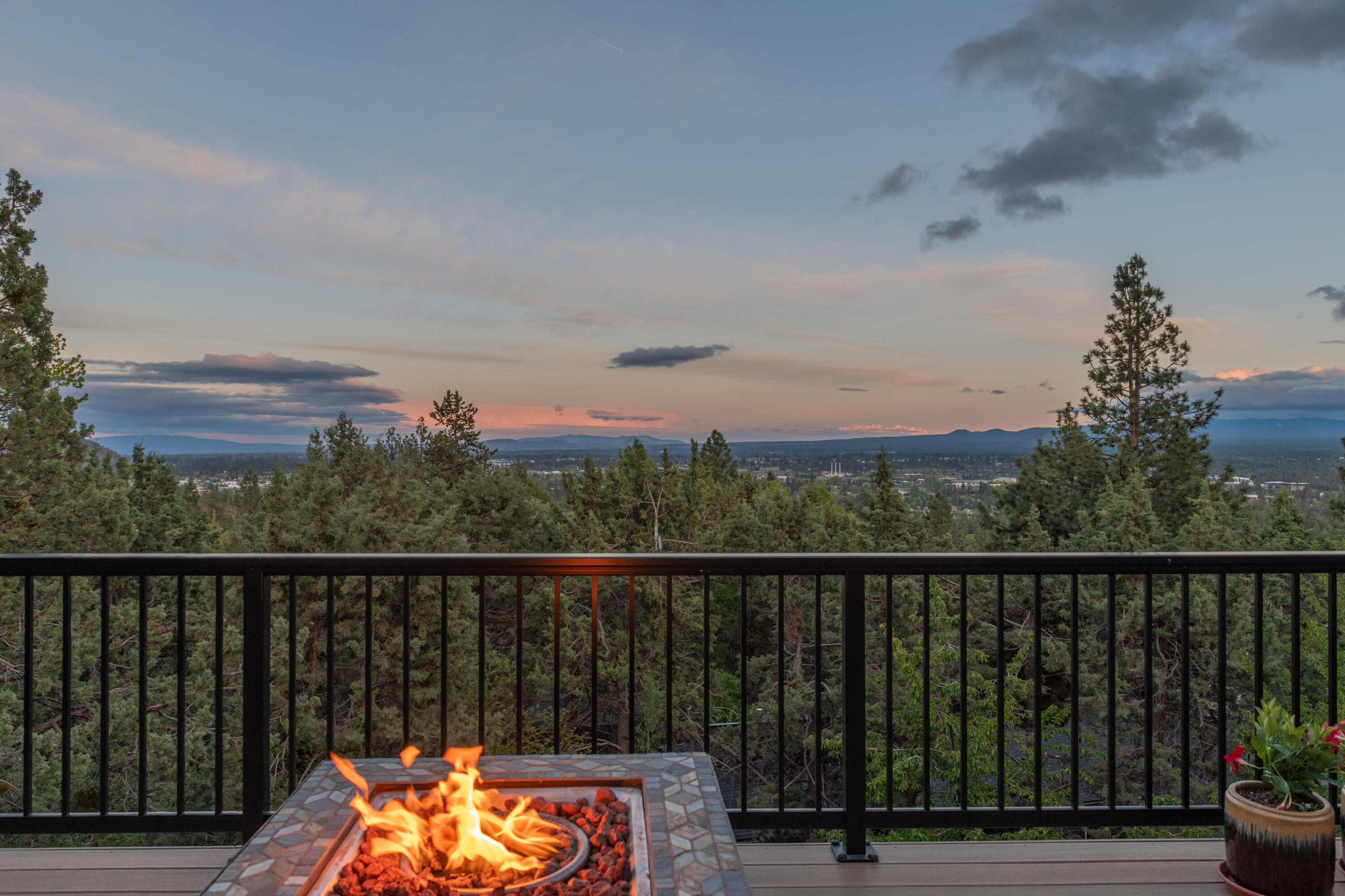 Perched on the south side of Awbrey Butte, this home is bathed in natural light, offers a great layout, and has long-ranging views. Conveniently located on Bend's Westside, there is easy access to trails, parks, the shops on Newport, the river, and downtown. There is great versatility with the primary suite and living spaces on the upper level, allowing the light and views to shine. Below, you will find two additional bedrooms and a flex space that could be an office, gym, or TV room. With added mini-splits, solar panels, and multiple fireplaces, your comfort in the house is assured. Also, with outdoor access from both levels, you will be able to enjoy the beauty of Bend from just about anywhere. The fenced backyard offers additional space to test your green thumb and is ready for you to create your own oasis. With tons of storage for your outdoor toys, this home offers everything you need to enjoy Bend, whether it's from the comfort of the home or from just outside the door.