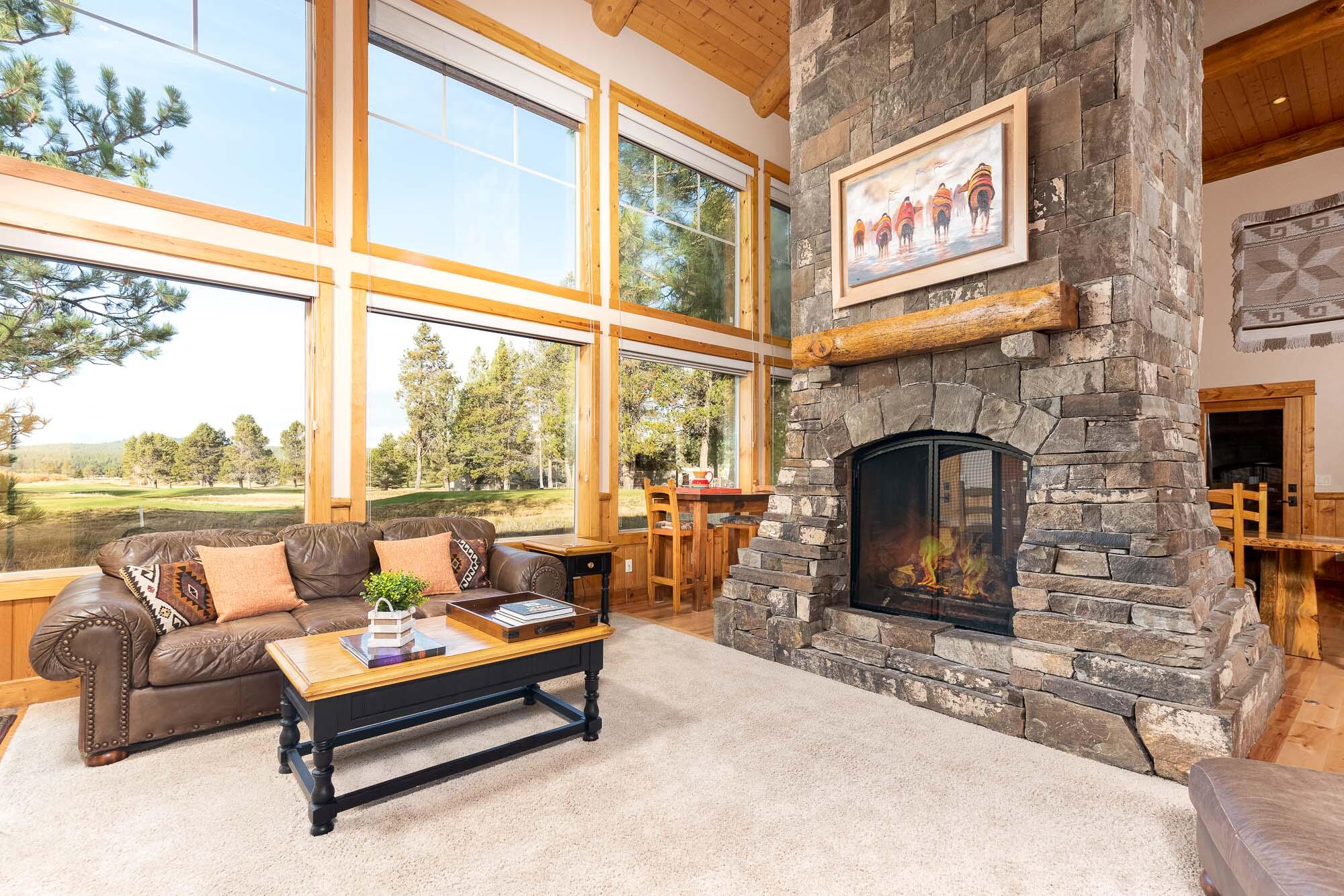 This truly beautiful & rustic lodge-style home on the coveted Colonial Lane was rebuilt in 2003! The moment you walk into this home you will be taken by the spectacular views of the golf course from the two-story wall of windows. Enjoy the magnificent floor to ceiling double sided stone gas fireplace that is the focal point of the great room and opens to the dining area. The home backs to Meadows GC & offers close access to the Village, SHARC & all the resort events. Chef's kitchen offers granite counters, huge island with eating bar & high-end stainless appliances. Host in true resort style with 6 spacious bedroom suites & full baths. One of the larger suites upstairs is configured as a family/media room w/ murphy bed, gas FP, wet bar, and big screen TV. Huge paver patio looking out to the GC lets you take the party outside. A/C. A 5-Star Rental performer!  Peek-a-boo view of Mt. Bachelor. Laundry room is also a half-bath. 3-Car garage. SHARC paid. Hot Tub.