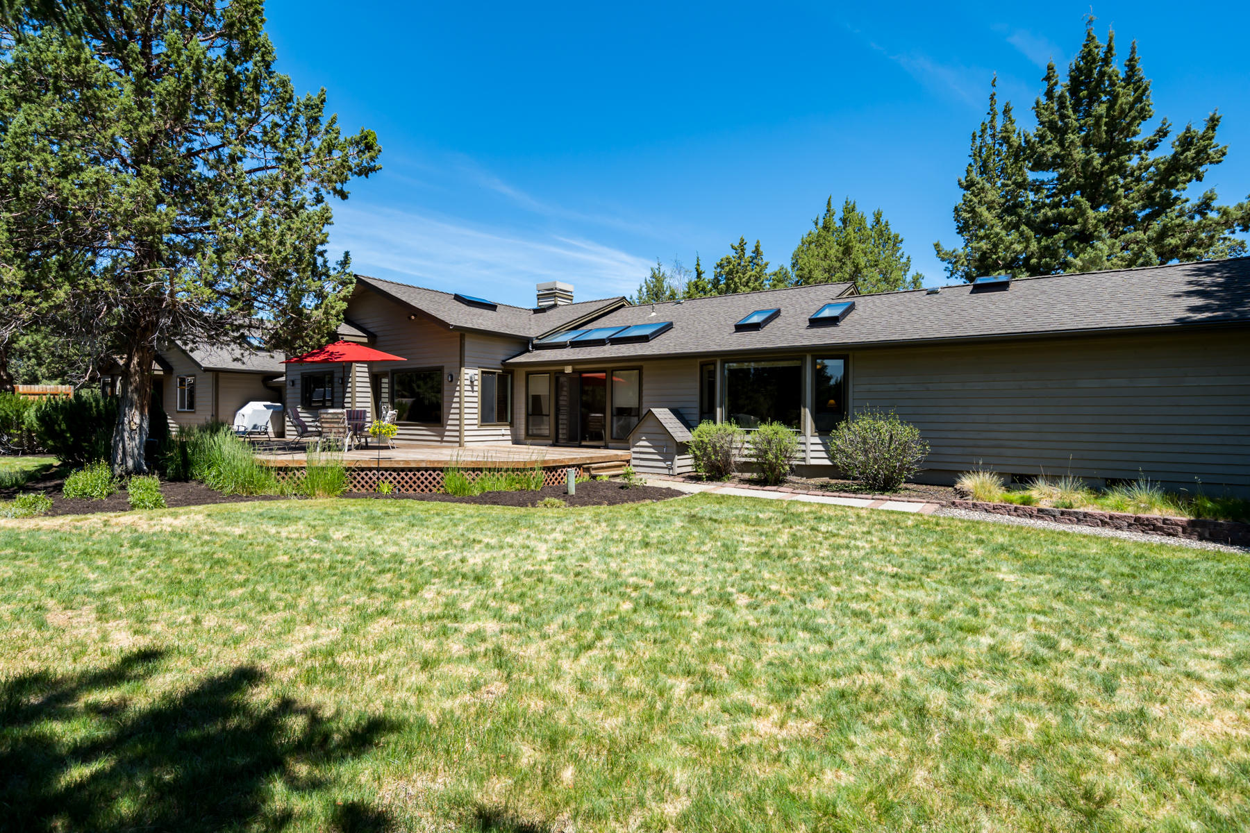 Discover Boonesborough, a tranquil neighborhood conveniently located between Bend, Redmond and Tumalo.  City Close and Country Quiet!  This spacious single-story Northwest Ranch Style home is perfectly situated on 2.5ac.  Open floor plan surrounding a two-sided stone fireplace.  Dual climate control systems and easily dividable into an ADU.  Recently upgraded kitchen and baths, featuring quartz & granite countertops, stainless steel appliances, and all new fixtures.  The large master suite features a walk-in closet, bay window, en suite with dual sinks, walk-in shower and a private retreat.  Outside, the grounds are an entertainer's delight, complete with expansive decking, grassy areas, two fountains, a European sauna and lots of natural landscaping.  There is an attached 3 car garage, plus a heated shop/studio and an oversized RV garage with additional covered parking.  A total of 6 garage spaces.  Property is adjacent to 1500+ acres of historic and protected open space. A rare find!
