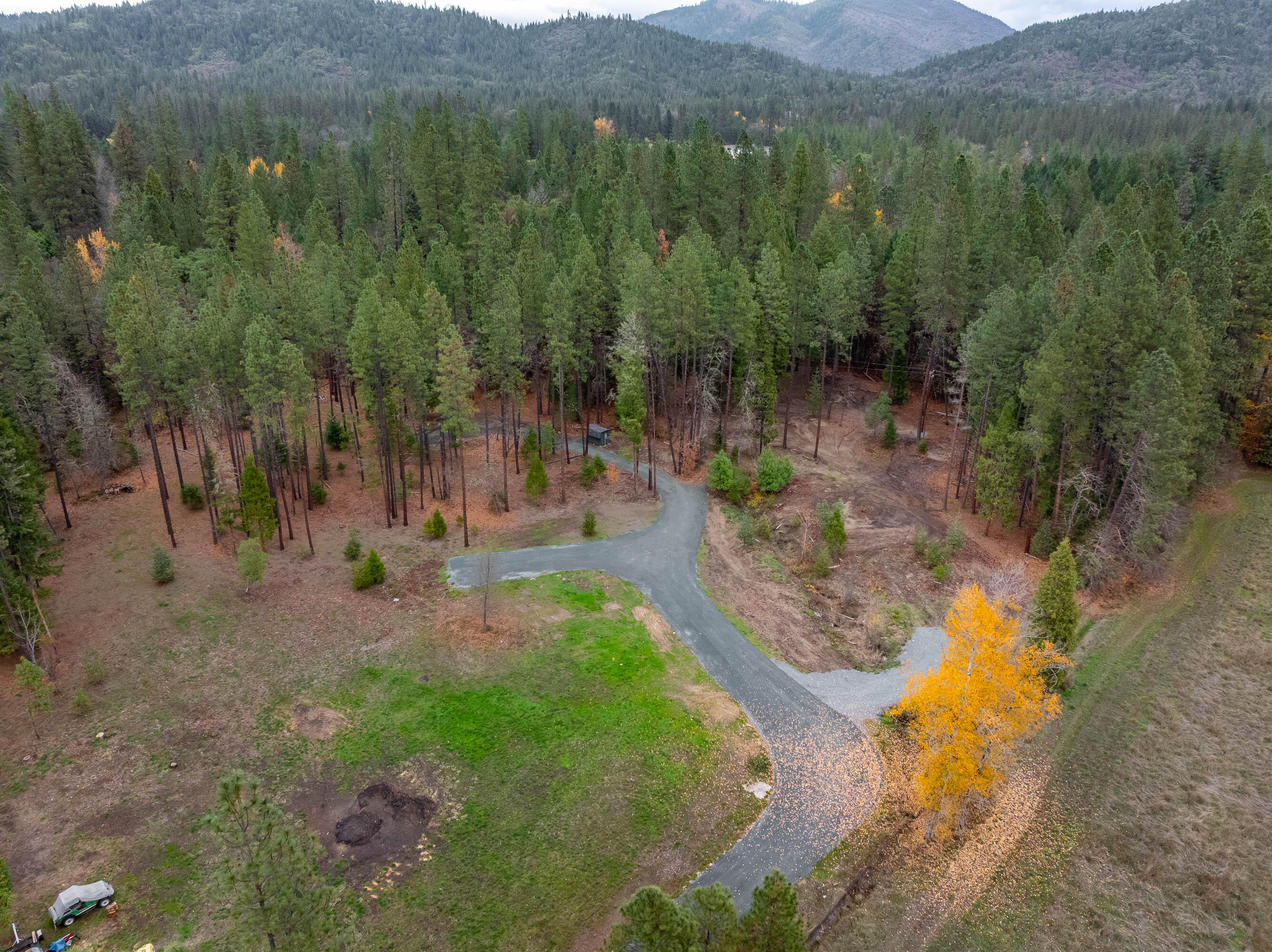 Turn Key property ready to build on! Discover the perfect setting for your future home on this 3.3 flat, usable acres, offering a combination of privacy, convenience, & build-ready improvements. Key infrastructure is already complete, including a new 4 Bedroom septic system, new private well, power installation & a gated driveway, significantly reducing build time & expense. Grab your builder or order your manufactured home! The property is set off of Pleasant Creek Road nearly 400' providing more privacy from traffic! Driveway is owned & not shared. Power is pulled with a 200 amp panel ready to go! Septic & well were just completed in 2025. The well produced 30+GPM upon drilling, & there is a 15GPM pump set in the well ready for use. Well equipment is located in the pump house/shed. The property also contains a seasonal creek! Located under 15 minutes to the City of Rogue River. This property is a must see for anyone looking for a rural build ready property! Schedule a tour today!