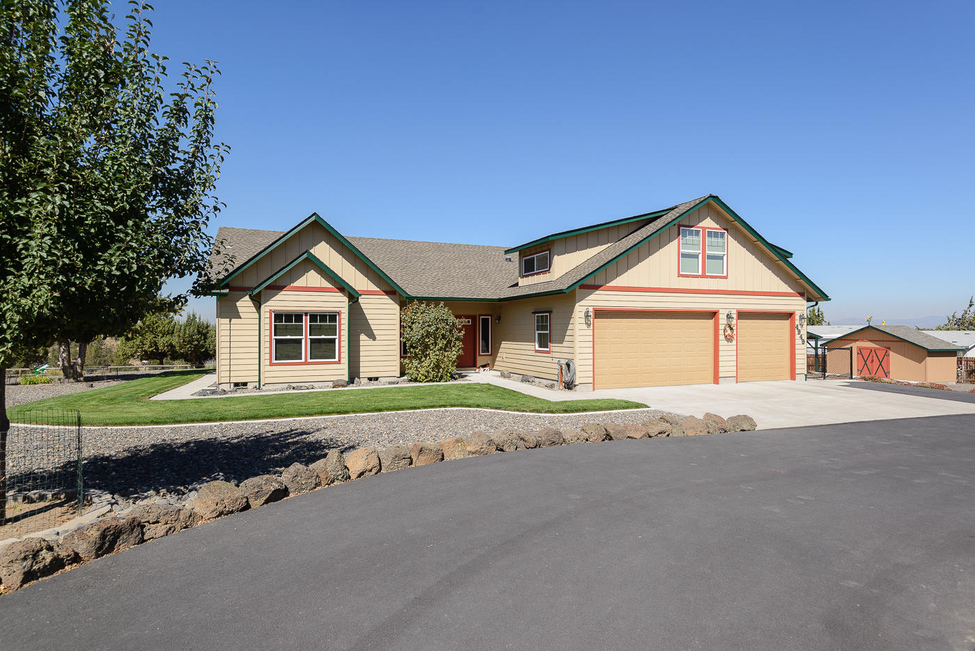 This immaculate, custom built, single level home with large bonus room above the garage offers privacy and country living on 2 acres only minutes away from downtown Prineville, Facebook, Apple and medical facilities. The well designed open floor plan home offers warmth and easy living featuring solid core wood doors and wood trim throughout, tile and wood floors and stone surround fireplace with pellet stove insert.. Fully fenced and gated with a manicured and treed lot, dog kennel, fenced garden area and large garden shed. Plenty of room for toys with an attached 3 car garage PLUS a separate 2 car garage and shop with 10 ft garage doors.