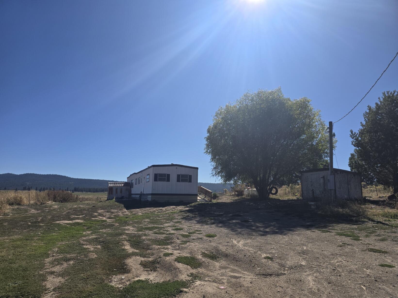 This 1.49-acre parcel offers stunning views of the Sprague River and surrounding mountains. It features well, septic, and power already in place, making it a great opportunity for someone looking to build their dream home in a picturesque setting. The property does require cleanup, and the 1972 manufactured home on the site is in disrepair and has been given no value. Don't miss out on this chance to create your own oasis in this beautiful location. Contact us today for more information.