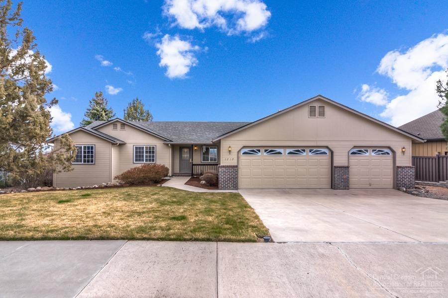 One-owner, well maintained and turnkey ready for you to make your own! Three bedrooms, 2.5 baths, single story, newer gas furnace (2018), 3 car garage and large, mostly finished storage space below the home. Vaulted ceilings, granite tile and breakfast bar in the kitchen plus built in hutch. Dining area with deck. Large living room with gas fireplace, master with vaults, bay window with view, ceiling fan, bath with tiled double vanity, shower and large walk-in closet. Gutters all around. Views of Smith Rock. Lower patio too! On cul-de-sac. Possible RV parking.