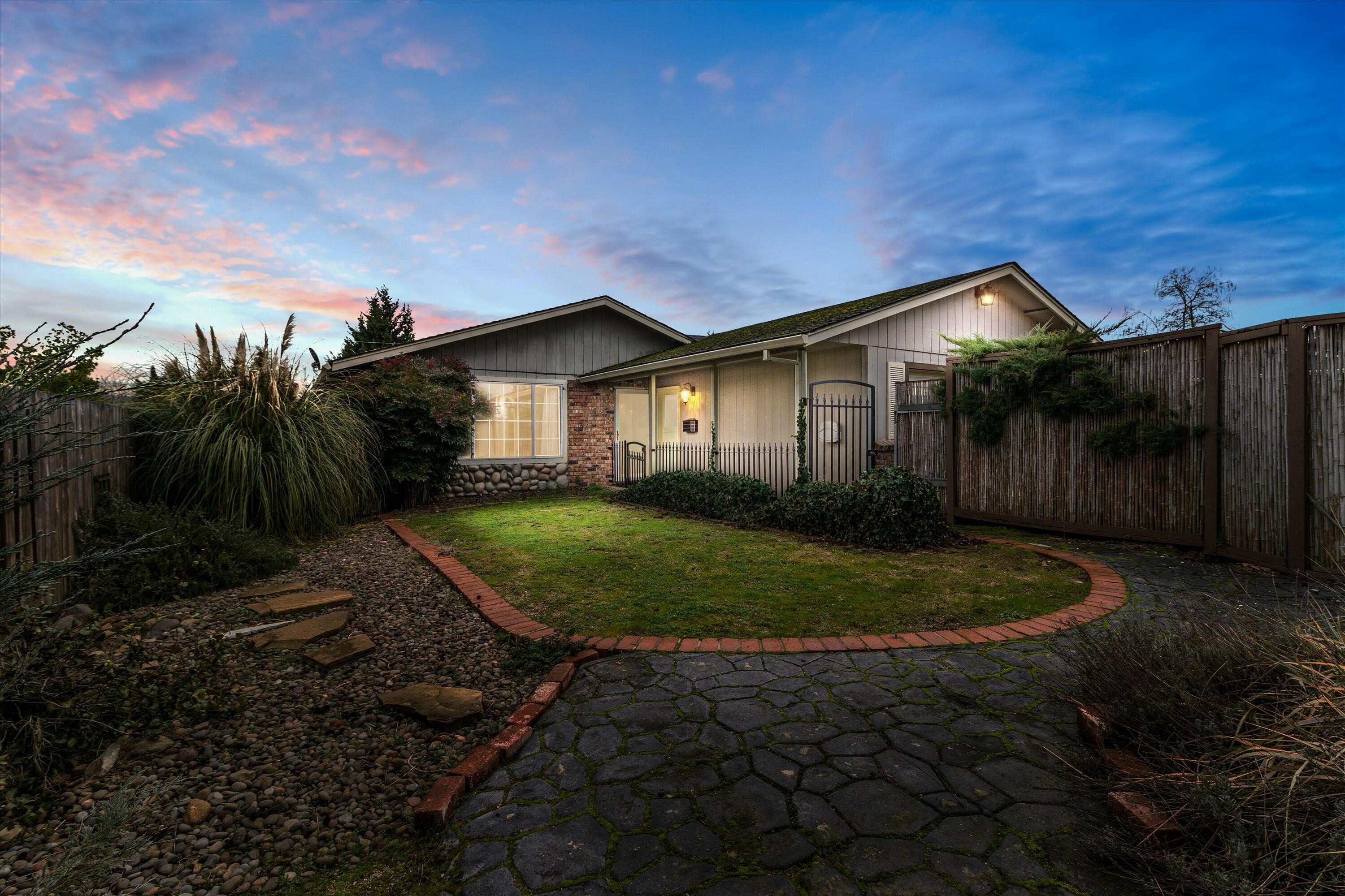 Charming single-level home in East Medford with brand-new carpet and private driveway! This property features a fully fenced yard, gated entry, and a mix of brick and stone accents. The bright living area boasts large windows, a skylight, and neutral tones. The versatile floor plan offers a spacious living room and room for personalization. The front yard has a beautiful stone pathway, and the backyard is perfect for gardening or entertaining. Conveniently located near schools, parks, and shopping, this home is move-in ready and full of potential. Schedule your showing today!