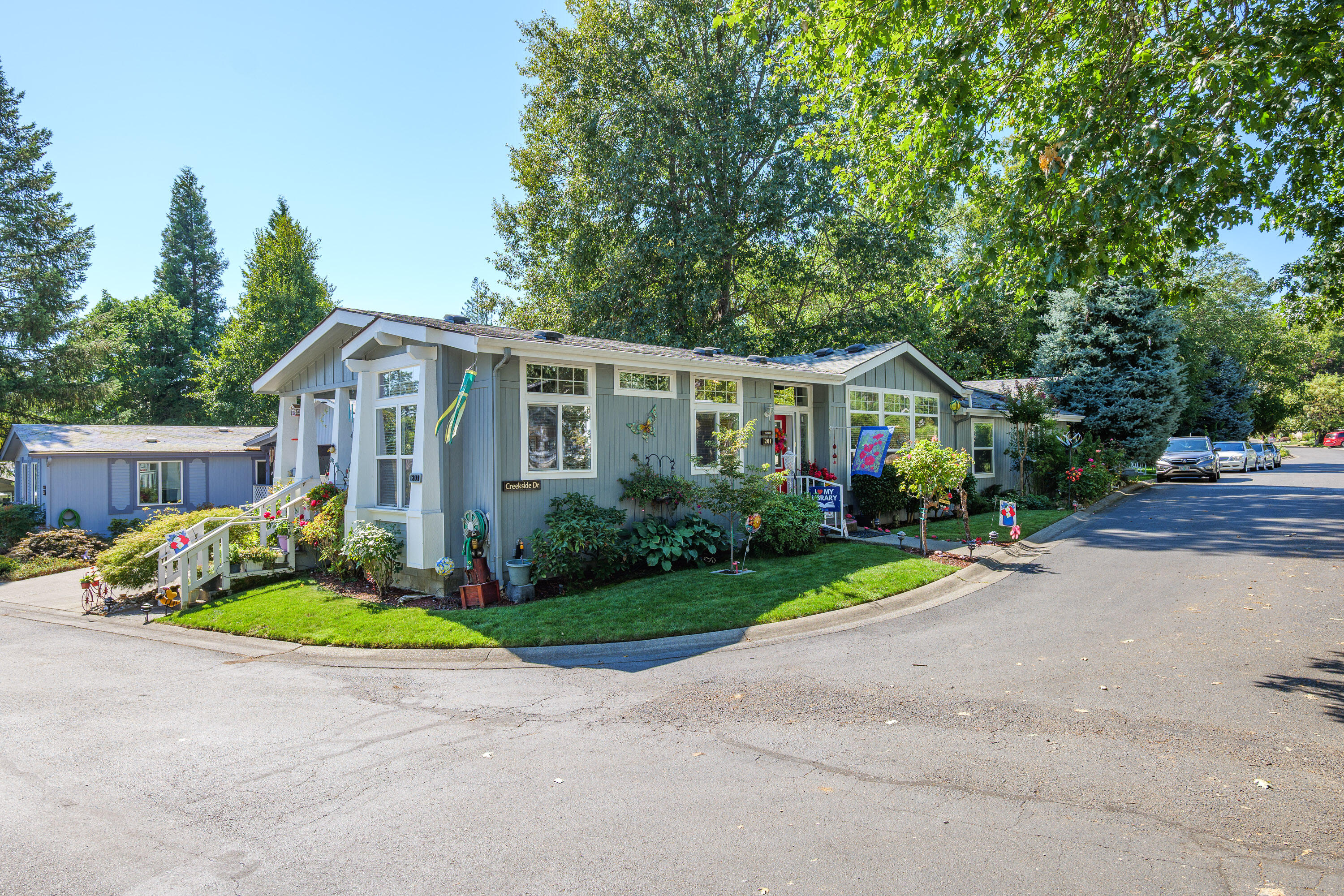 Beautiful home in Highland Heights, a 55+ community!  This Spacious home features a bright living room with vaulted ceilings and picture windows, a dream kitchen with island, breakfast nook, pantry, and formal dining room. The oversized primary suite offers a walk-in closet, dual sinks, soaking tub, and shower. Second bedroom also has a walk-in closet, 3rd bedroom is perfect for a den or office.  Laundry room with sink.  Enjoy the landscaped backyard with decorative fountain from the redwood deck. Carport and  storage shed,  Space rent $850. Small pets welcome with park approval.