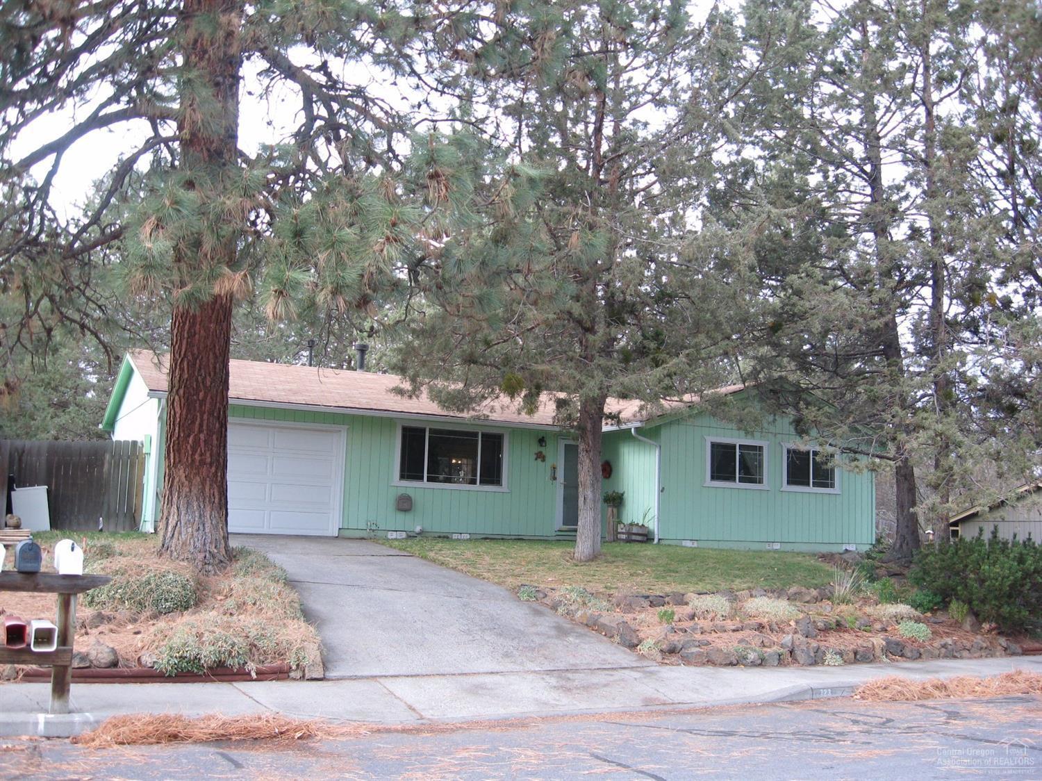 The perfect starter home or ideal for someone who is downsizing. You will appreciate the convenient location close to shopping, Vince Genna Stadium and nearby parks. Recent upgrades include new windows, garage door and opener, gas heating stove and laminate flooring throughout the main living area. Spacious yard with mature trees and a fenced backyard with a pergola covered deck. This is a well maintained home in a sought after neighborhood.