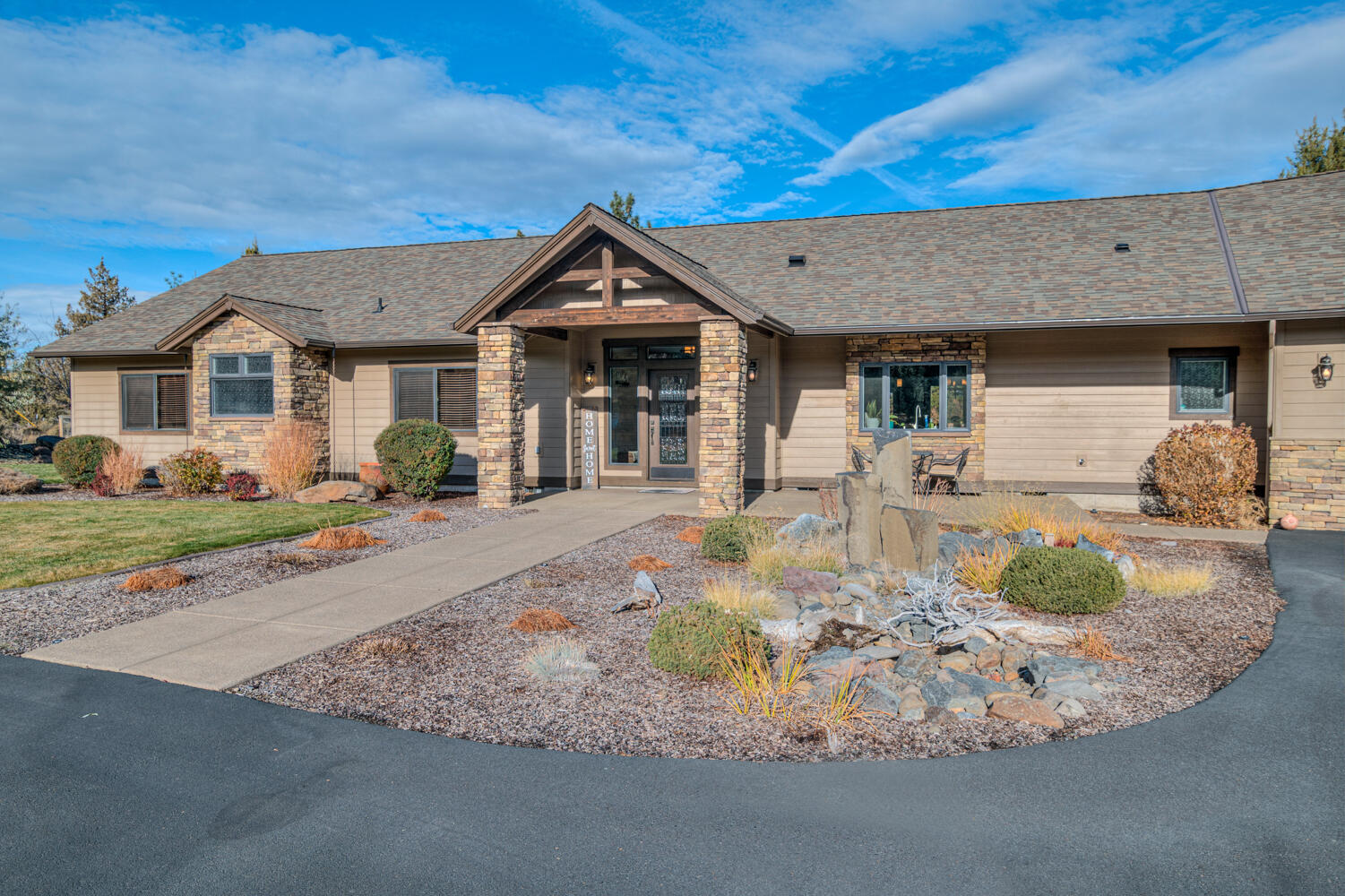 Discover the perfect blend of elegance and comfort in this stunning single-level home on 1.19 acres. Thoughtfully designed by the homeowner, every detail reflects exceptional craftsmanship and care. The open-concept layout is bright and inviting, with a wall of windows that frame the beautifully landscaped backyard, complete with a covered patio and hot tub for year-round enjoyment.
The gourmet kitchen is a showstopper, featuring custom Hemlock cabinetry, slab granite counters, a Blanco undermount sink, a large island, and premium KitchenAid appliances including a gas cooktop, double ovens, and a warming drawer.
The primary suite offers a peaceful retreat with a spa-inspired ensuite bathroom designed for relaxation. Additional highlights include a 38-foot attached RV bay and direct neighborhood access to the National Forest, perfect for outdoor adventures.