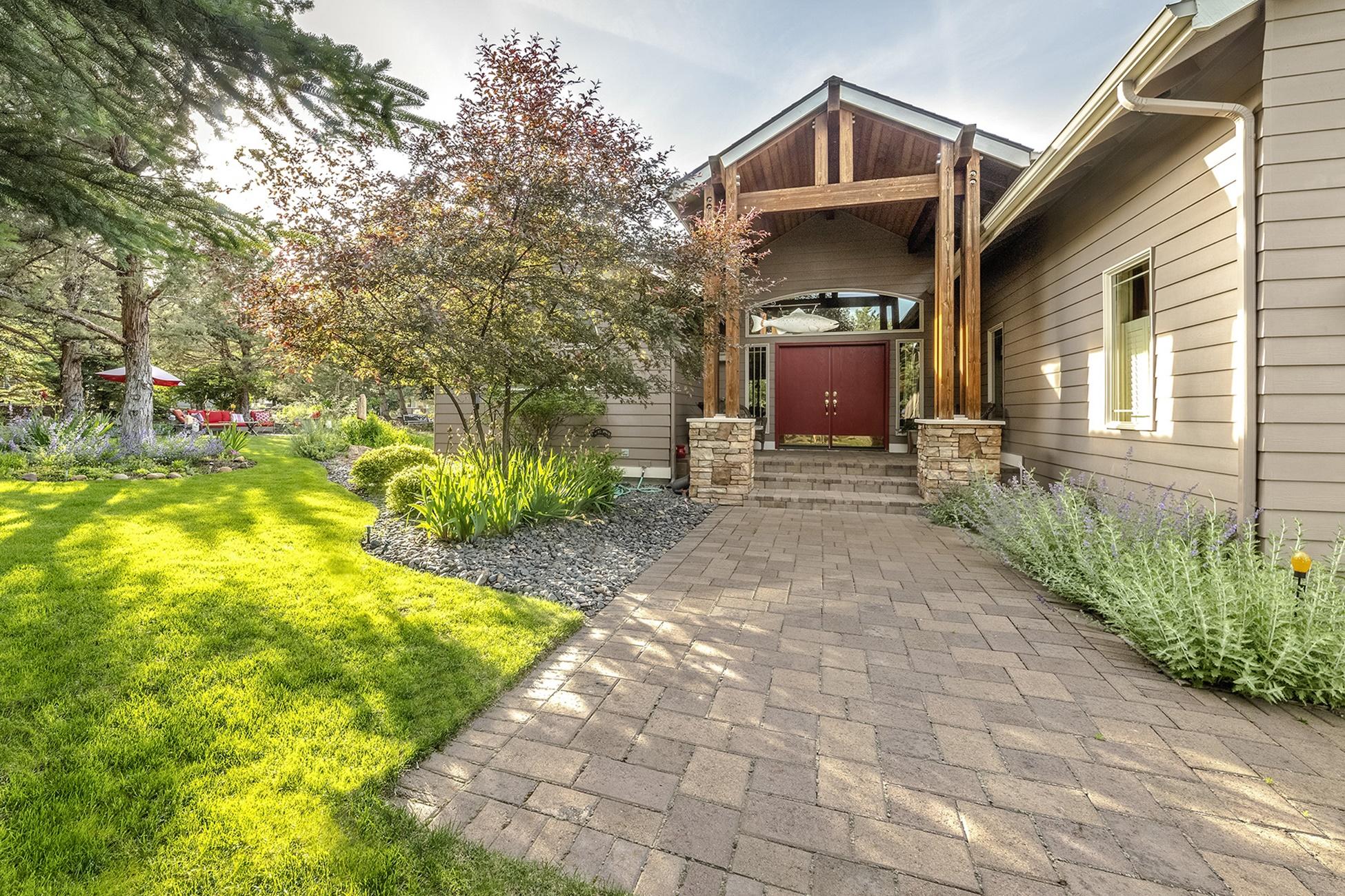 Your next adventure awaits at the Ridge at Eagle Crest. Don't miss this impeccably maintained single level home positioned on a beautifully landscaped corner lot with 3+ car garage! The .44 acre yard wraps around the house and offers tons of outdoor entertaining space, including a paver patio, soothing water feature, and a large covered exotic wood deck. The interior lives large with an open floorplan, vaulted ceilings and spacious rooms. Highlights include: steam shower and jacuzzi tub in owner suite, surround sound system, wet bar, gorgeous white oak cabinets & built-ins throughout, new heating system, AC, skylights and under cabinet lighting in kitchen & laundry. The amazing 3 plus car garage is a welcome bonus with room for your shop, projects and all the Central Oregon toys you desire. The community is beautifully maintained, quiet & gated. Not to mention, you are surrounded by nature, walking trails, golf courses and all that