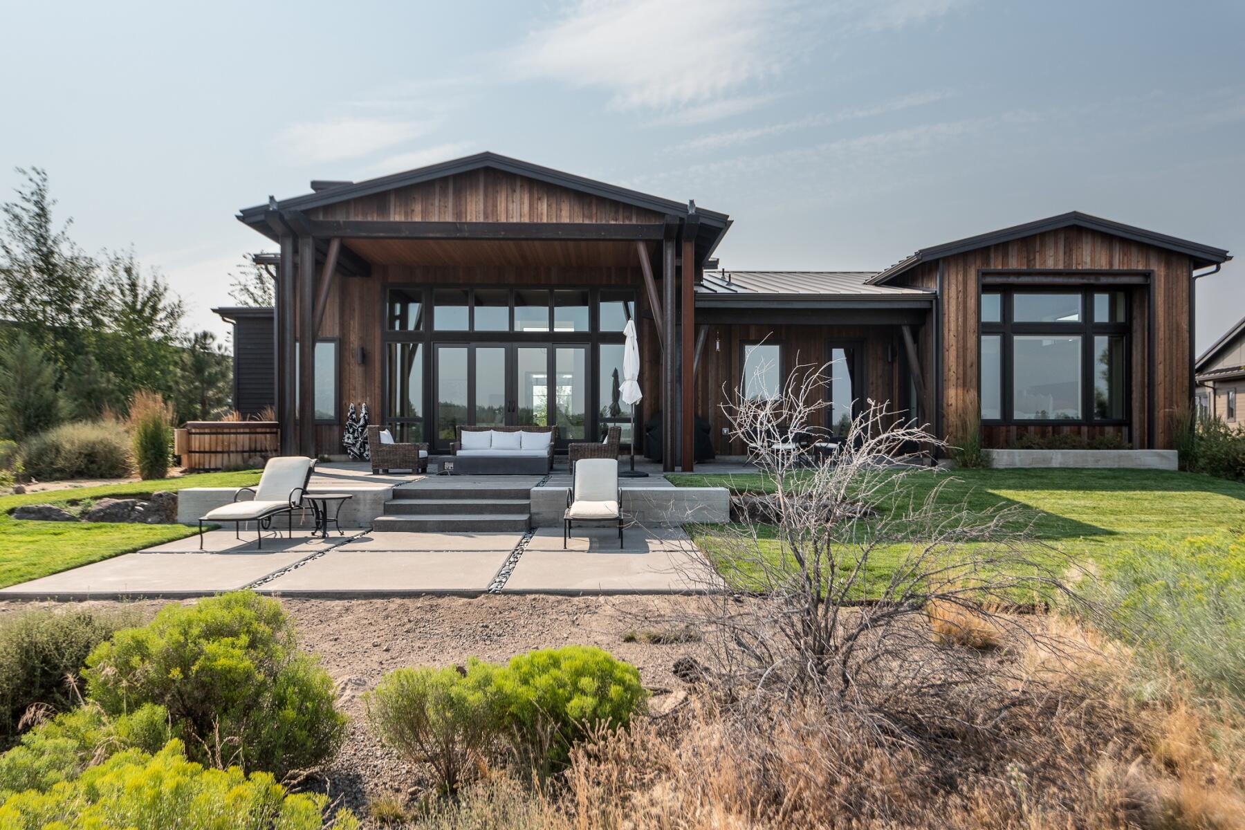 Cool, contemporary designed 3,186 sf single level home in the gated Tartan Druim neighborhood at Tetherow. Overlooking Kidd's Corner, this sleek remodeled home features a vaulted great room with large windows to soak in the natural light, reclaimed beams from a 120 year old tobacco drying barn in Kentucky, 3 en-suite bedrooms, office, bonus room, extra-large two car garage, and huge mud/laundry room. The stylish kitchen includes dolomite counters, stained oak cabinets, Jenn Air appliances and dynamite CB2 light fixtures. The peaceful outdoor space is fantastic with a covered entertaining area, built in firepit, Northern Lights Cedar tub and tiered lounge areas to soak in the sun, enjoy nature and the views. This home is situated just across the street from the community park which features 3 acres of grass, bocce, gas firepit, grill, kitchen and restrooms. Great location close to schools, shopping, and tons of outdoor recreation including direct access to Phil's Trail.