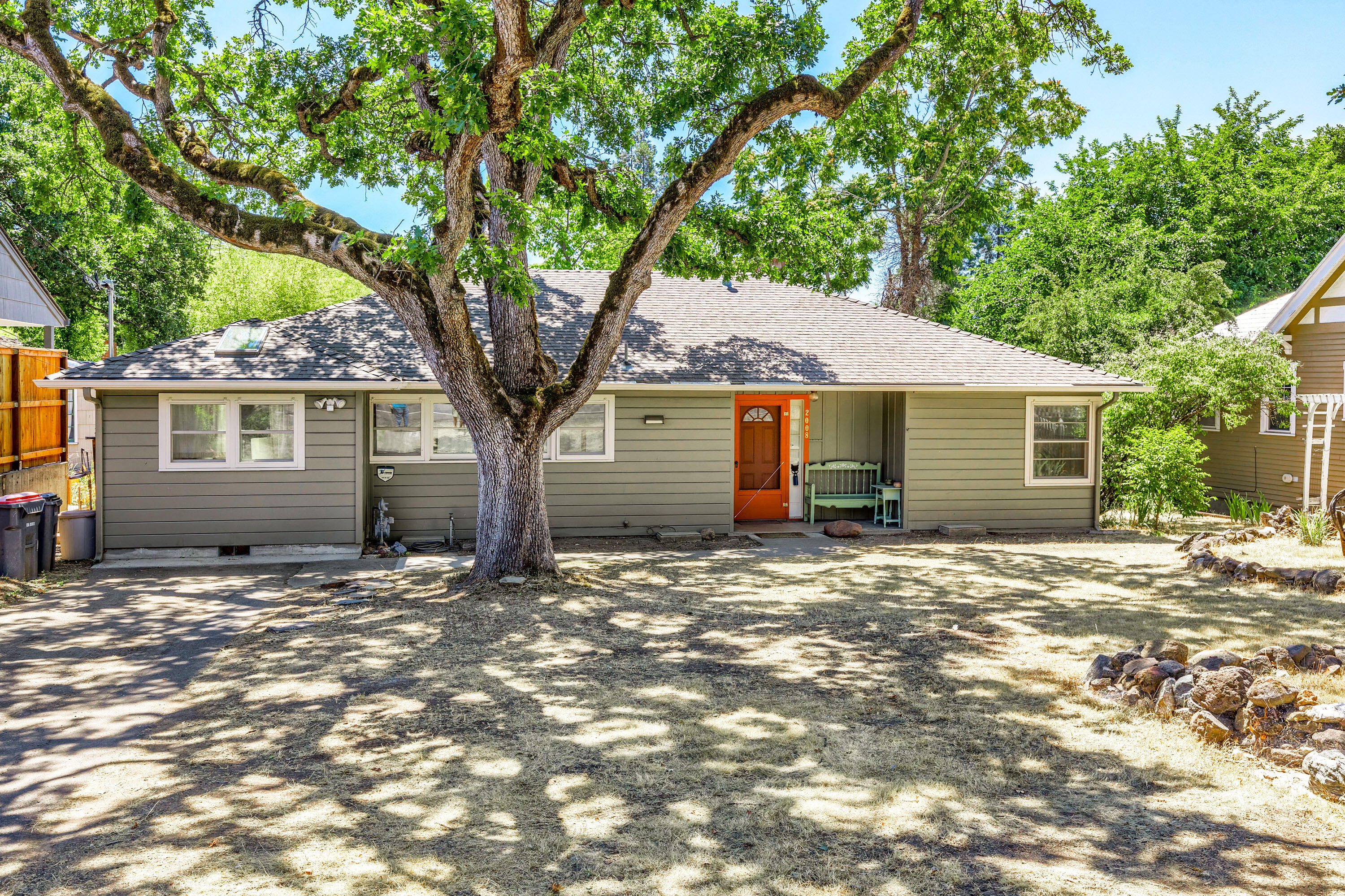 This spacious and charming home is full of wonderful character. A must see inside! Located in a desirable East Medford neighborhood, close to shopping and schools, it is situated on a .20 acre lot and offers 3 bedrooms, 2 bathrooms, plus the option of an office or a 4th bedroom. Enjoy the elegance of crown molding, solid wood flooring, and large windows bringing in an abundance of natural light. Originally built in 1947, this great home is complemented by a wonderful, cozy living room, lots of built-ins and some recent updates and additions, including a delightful retro kitchen, charming bathrooms and the addition of a large bedroom. The bonus room offers versatility as a workspace, hobby room, or family room. With a little yard care, the spacious grounds offer plenty of space to relax and play.