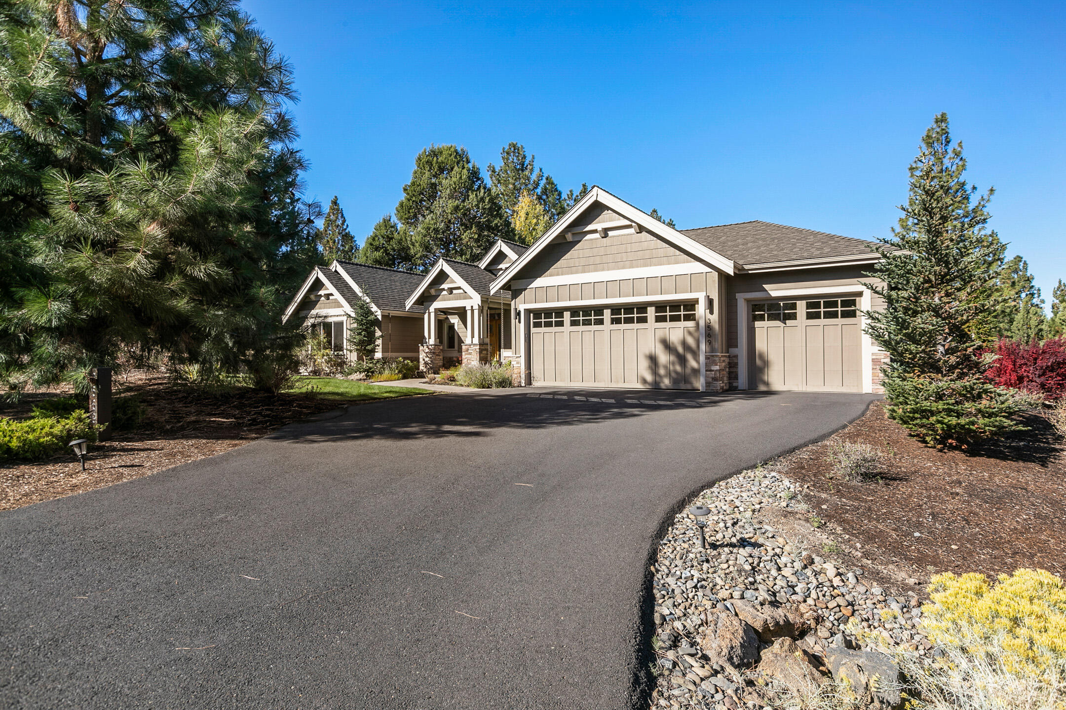 This quality built home by Dave Hasenroehrl is located on a .40 acre lot in the private & gated golf community of Awbrey Glen, regarded as one of Bend's best.  Single level with a deep 3 car garage and abundant storage, 3 bedrooms PLUS office & 2 ½ baths.  Spacious Primary bedroom suite has double door entry and good separation from the other two bedrooms & office.  Custom finishes include solid granite countertops, stainless steel appliances, hardwood flooring, tiled baths & entry way, wide trims and molding and boxed beam ceiling in the office. Open Great Room floorplan features vaulted ceilings, stone gas fireplace flanked by custom bookcases and entertainment unit.  Floor to ceiling windows capture natural light & provide views to the natural backyard terrain with mature trees and landscaping. The well-designed kitchen has a breakfast bar with room for 6, plus a wonderful dining area with access & views to the backyard paver patio for al fresco entertaining and dining.
