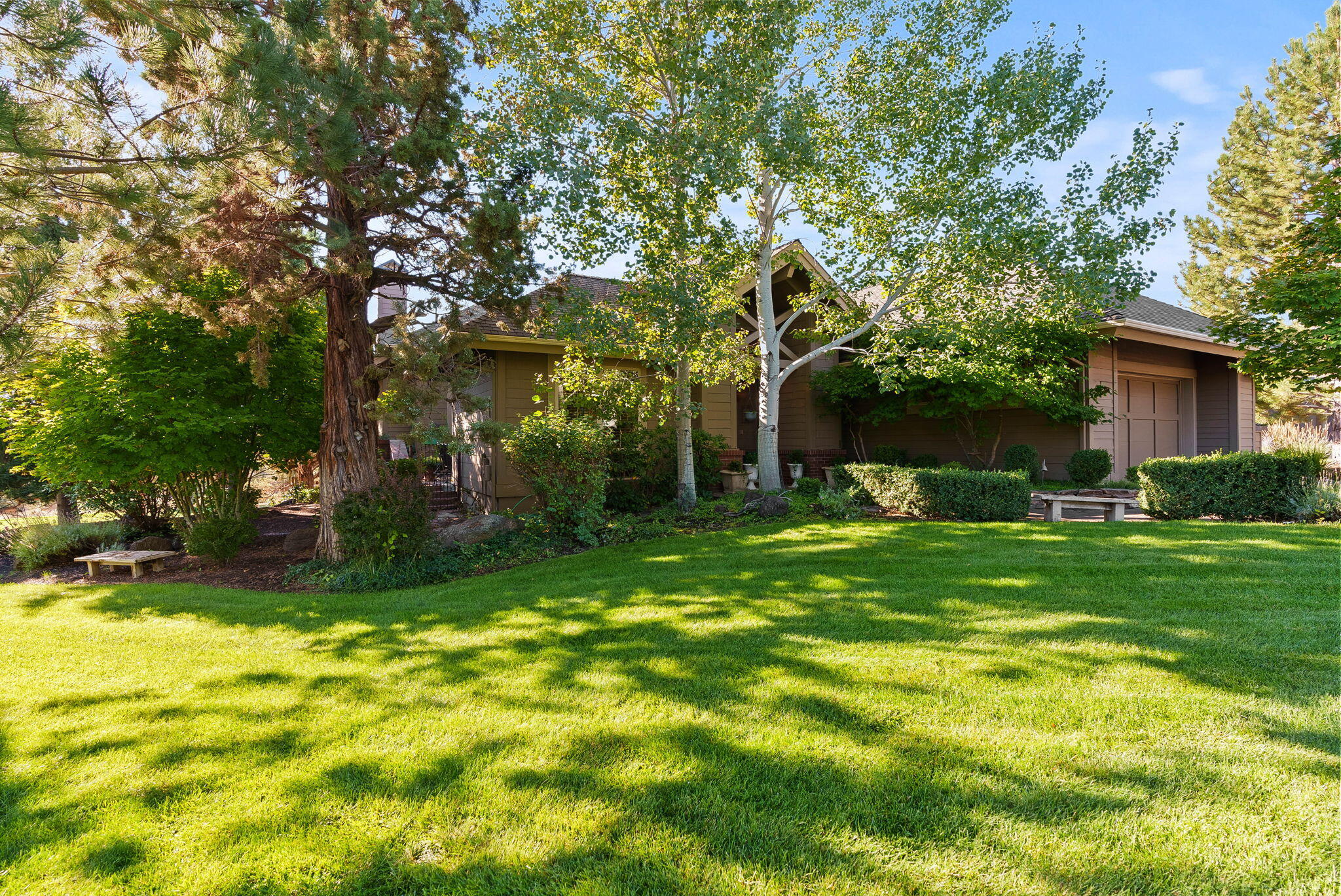 Custom single-level home located on a private gated cul-de-sac, perfectly positioned on the tee box of the 17th fairway of The Challenge Course in Eagle Crest Resort. This exceptional property offers the rare combination of golf course living with breathtaking easterly views that stretch across the fairway to the Ochoco mountains and city lights beyond.

The open concept floor plan showcases beautiful cherry hardwood floors and matching cherry cabinetry throughout. 

Well-appointed kitchen with granite countertops, gas cooktop, and breakfast bar. 

The primary suite features a soaking tub, tiled walk-in shower, and a generous walk-in closet.

A guest room includes an en suite bath, while a half bath accommodates visitors. The flexible third bedroom doubles as a den for those who need versatile living space.

Private courtyard with tranquil water feature, and covered deck overlooking the fairway and mountains. 

Garage with a built-in workbench and storage cabinets.
